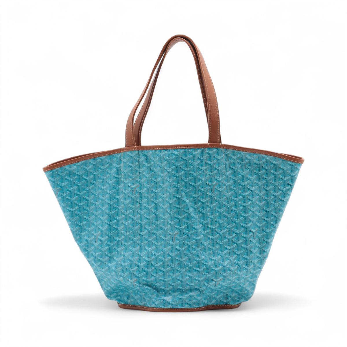 La borsa Goyard Belharra Tote Bag in Turchese e Tan è un accessorio sorprendente ed elegante che unisce lusso e praticità. Realizzato in tela Goyard dipinta a mano, il corpo turchese vibrante è splendidamente completato da finiture e manici in pelle