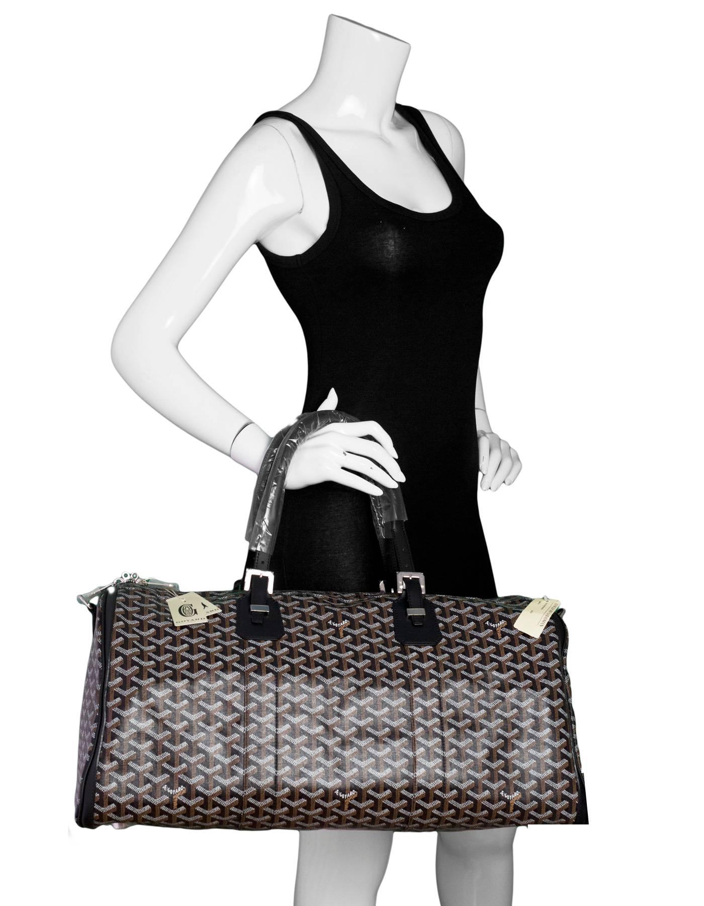 Goyard Black Croisiere 50 Duffle Bag NEW

Made In: France
Color: Black
Hardware: Silvertone
Materials: Coated canvas, leather, metal
Lining: Yellow textile
Closure/Opening: Double zip top 
Exterior Pockets: None
Interior Pockets: One zip wall
