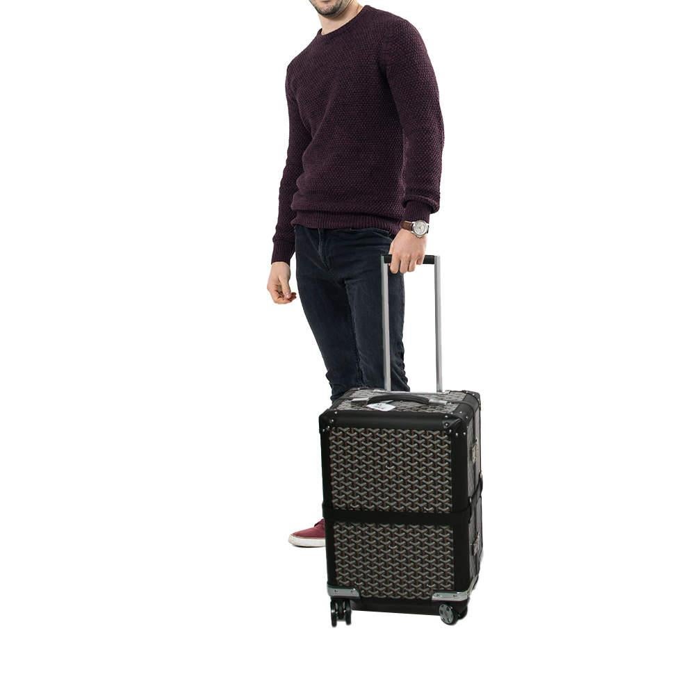 Introducing the Goyard Black Goyardine Canvas and Leather Bourget PM Trolley a perfect blend of style and functionality. This chic trolley features the iconic Goyardine pattern crafted from durable canvas and leather. Its spacious interior ensures