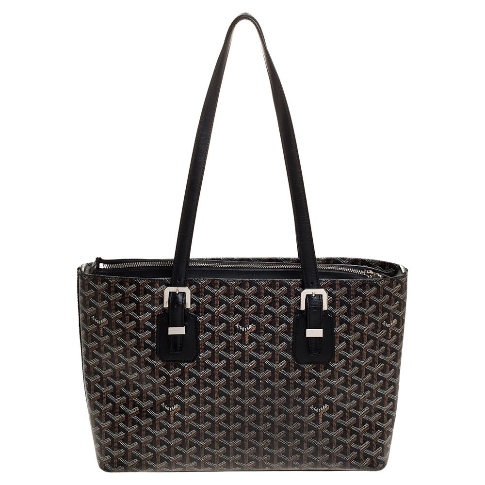 Goyard's Goyardine pattern adds a luxurious touch to its bags and this Okinawa tote will brighten up your looks! This tote features the signature pattern on the canvas exterior in a black shade. Accented with leather trim, this bag comes with dual