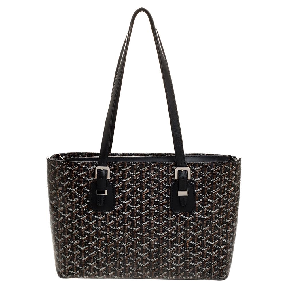 Goyard's Goyardine pattern adds a luxurious touch to its bags and this Okinawa tote will brighten up your looks! This tote features the signature pattern on the canvas exterior in a black shade. Accented with leather trim, this bag comes with dual