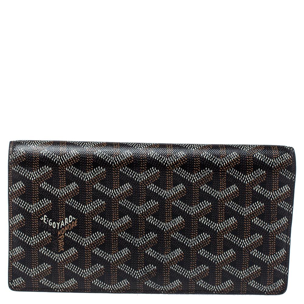 This wallet from Goyard brings along a touch of luxury and immense style. It comes crafted from coated Goyardine canvas and equipped with compartments and multiple slots just so you can neatly carry your cards and cash.

Includes:Original Box,
