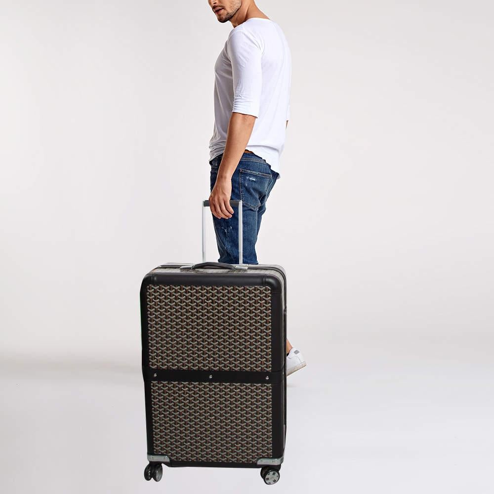 Travel in style with the Goyard Satolas GM Rolling Suitcase. Crafted from Goyards signature Goyardine canvas this spacious suitcase features leather trims and a durable rolling mechanism. With a refined design and practical compartments it's a