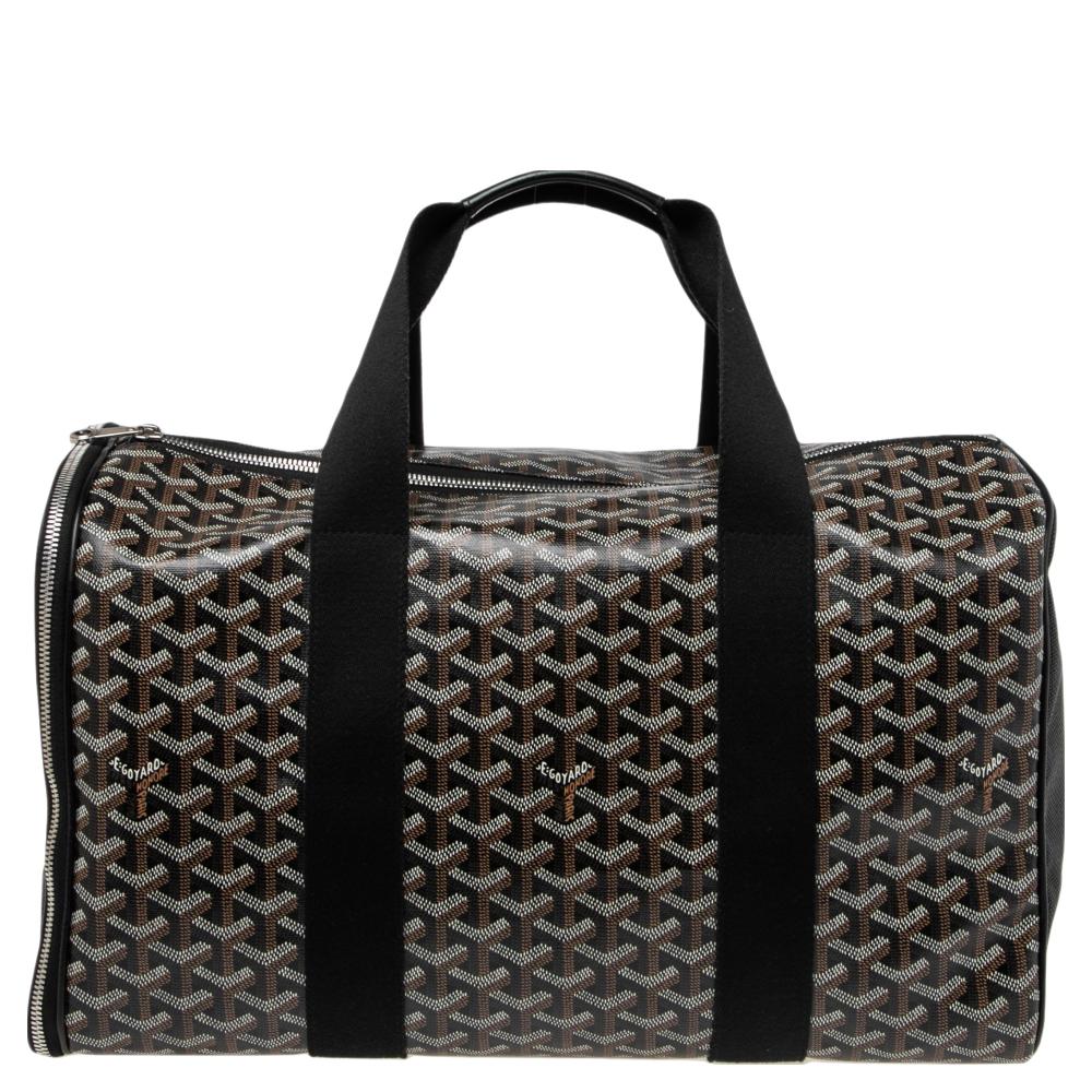 The Goyard Voltigeur MM is marked by qualities such as refined craftsmanship and first-rate classic style. It is crafted from their Goyardine coated canvas and features leather trims, two top handles and silver-tone hardware. The interior is lined