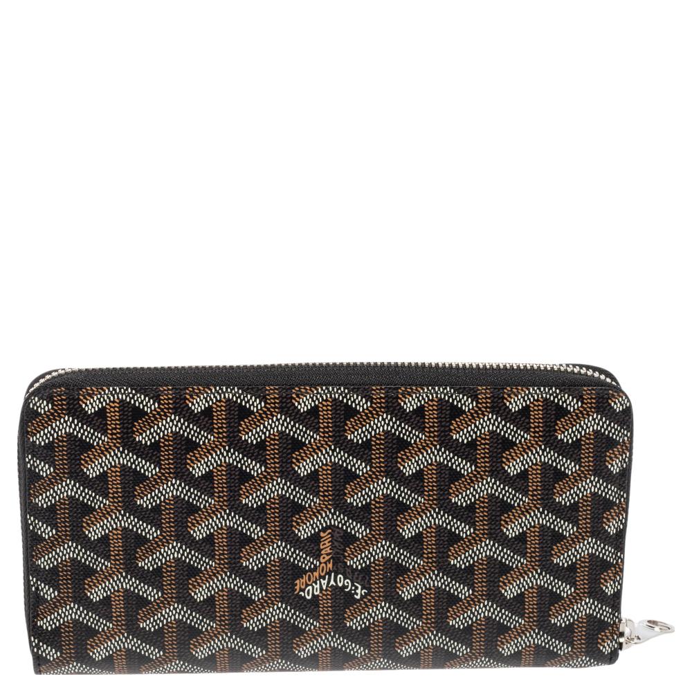 This wallet from Goyard brings along a touch of luxury and immense style. It is crafted from the brand's signature Goyardine canvas & leather in black and is designed with a zip closure that leads to an interior equipped with compartments so you can