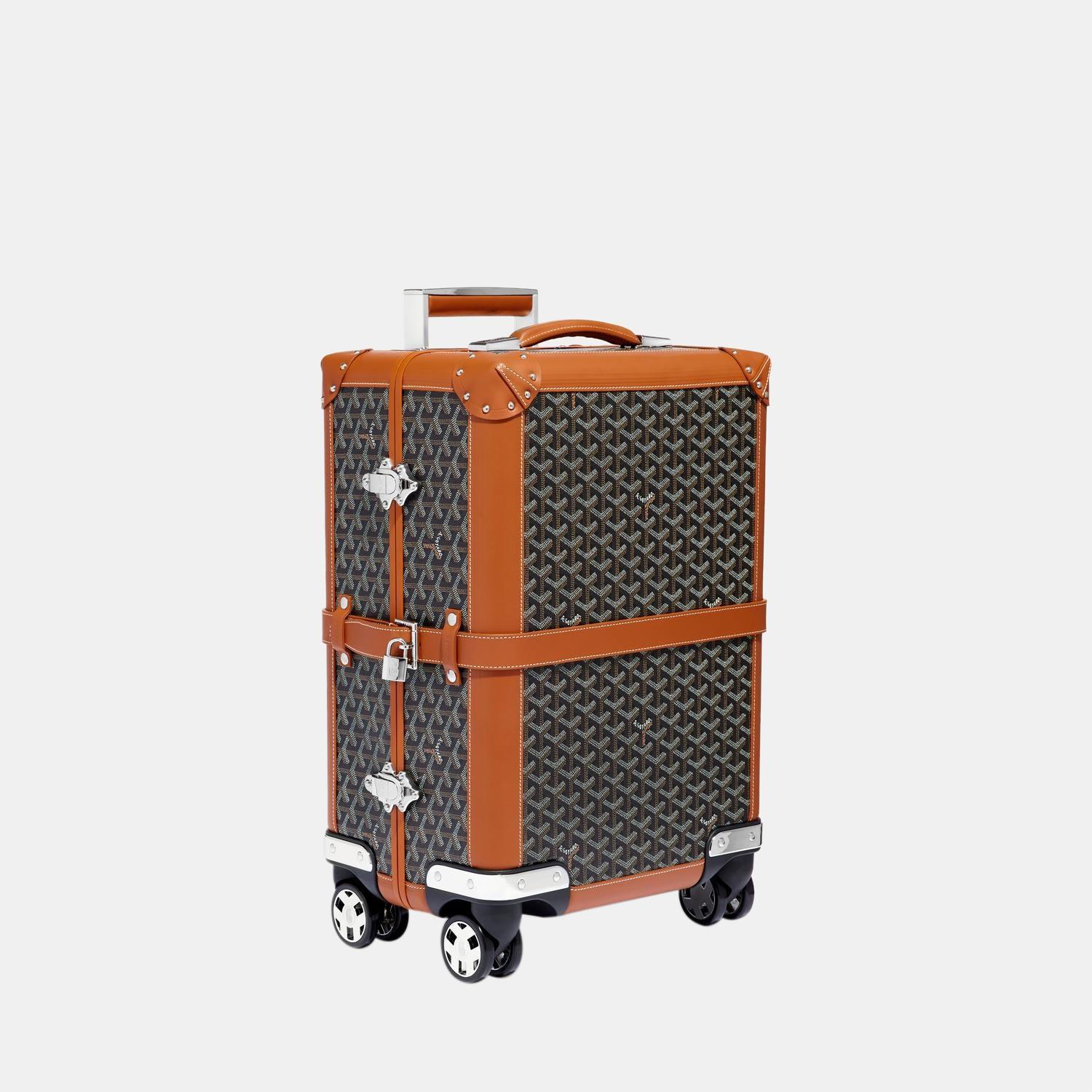 Élevez votre style avec cette valise trolley noire et beige de Goyard. Alliant forme et fonction, cet accessoire exquis incarne la sophistication et vous permet de vous démarquer avec élégance et praticité à vos côtés.

