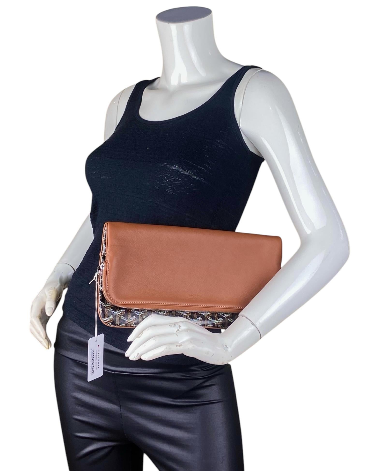 Bolso de mano Goyard Negro/Tostado Goyardine Sainte Marie Soft

Fabricado en: Francia
Color: Negro y fuego
Herrajes: Silvertone
Materiales: Lona recubierta y cuero
Forro: Lienzo
Cierre/Apertura: Solapa superior con cierre de cremallera
Bolsillos