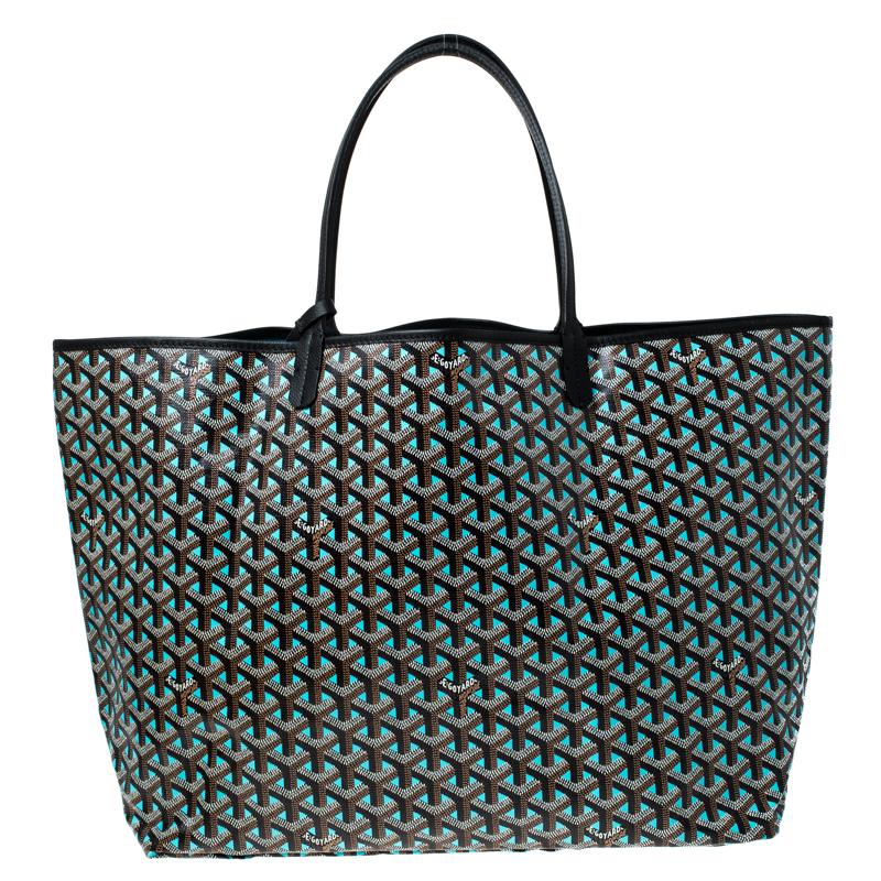 With the signature Goyardine print, the St Louis GM tote from Goyard is crafted with canvas and features dual sleek handles. The bag is accentuated with silver-tone hardware, an attached pouch and leather trims. Lined in canvas, the interior offers