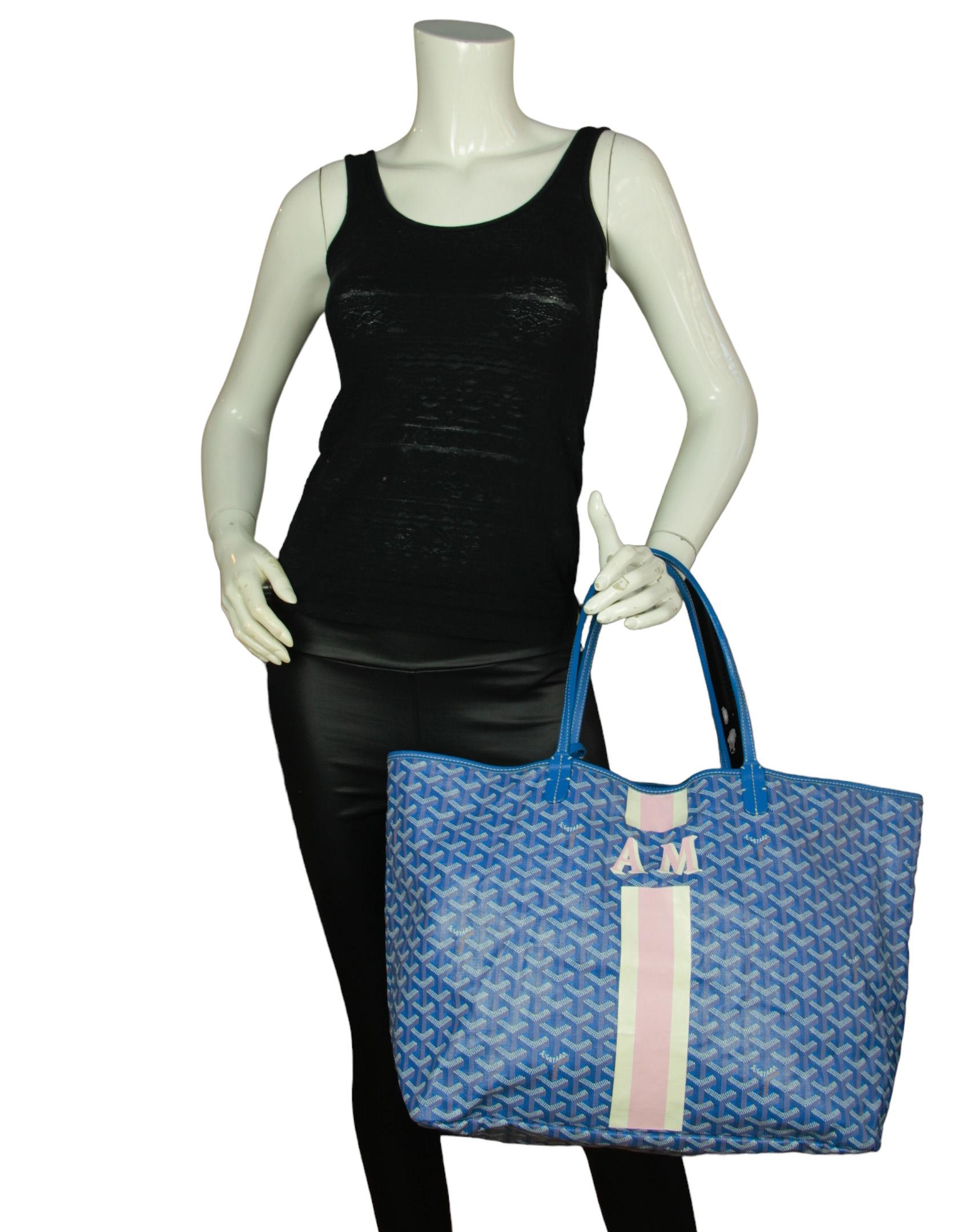 Goyard Blue Canvas Goyardine Saint Louis GM Tote w/ Initials

Made In: France
Color: Blue
Hardware: Silvertone
Materials: Canvas
Lining: Canvas
Closure/Opening: Open top
Exterior Pockets: None
Interior Pockets: Insert with snap closure
Exterior