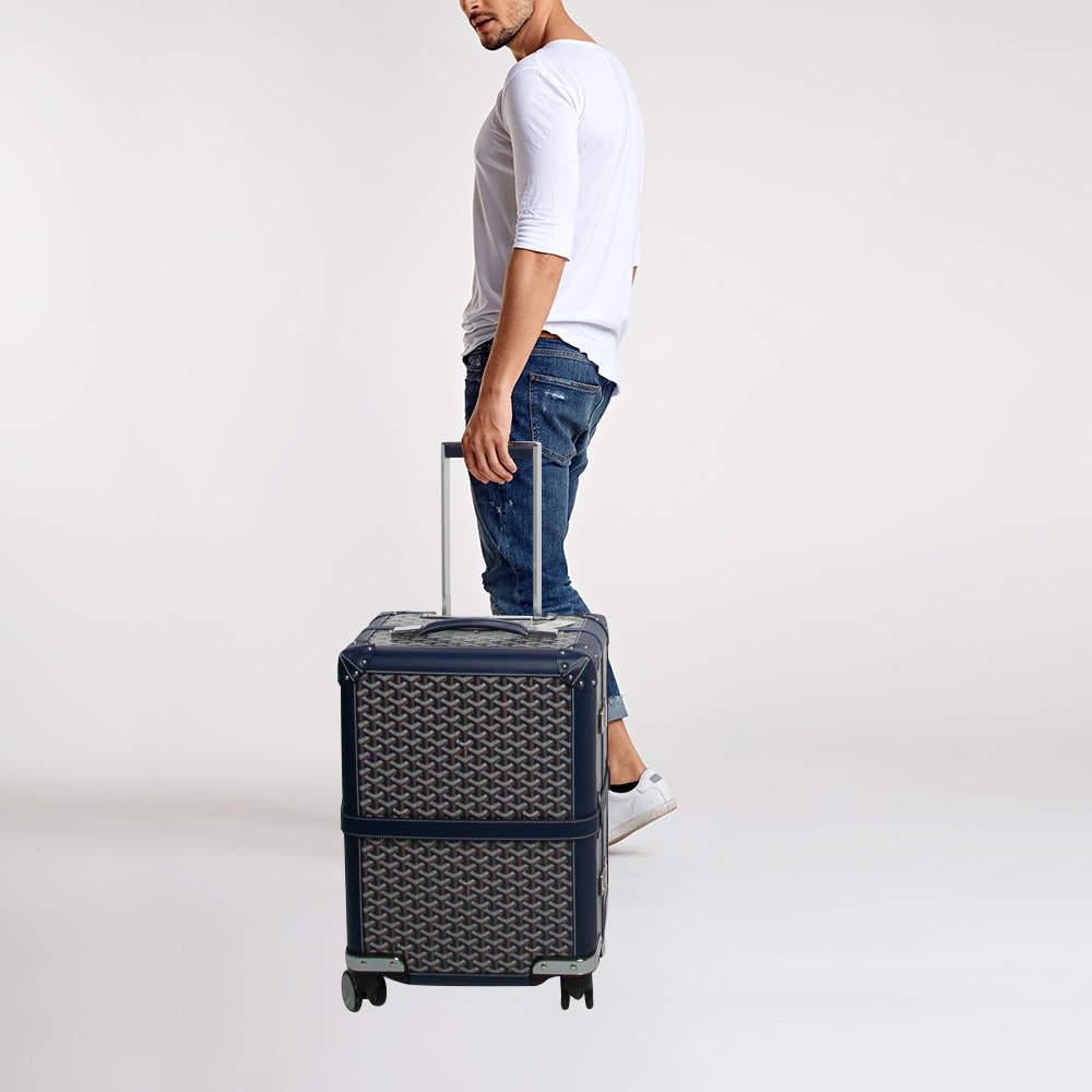 The Goyard Bourget PM Trolley Case combines style and practicality showcasing Goyard's iconic Goyardine pattern. Its compact size is perfect for frequent travelers offering organized compartments for seamless packing. The durable coated canvas