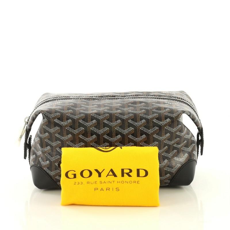This Goyard Boeing Trousse de Toilette Pouch Coated Canvas 25, crafted from black coated canvas, features silver-tone hardware. Its zip closure opens to a yellow fabric interior with slip pocket. 

Condition: Excellent. Minor wear in interior,