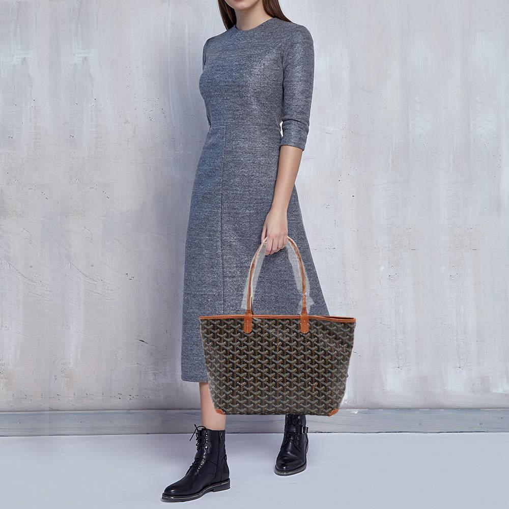 The Goyard Artois PM tote is a stylish and practical handbag. Made with durable coated canvas and leather it features the iconic Goyardine print in pink showcasing the brands heritage. The Artois tote offers ample storage space and comes with sturdy