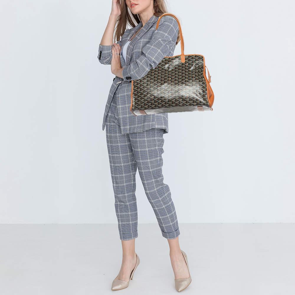 This Hardy PM tote from Goyard is stylish, sturdy, and practical for everyday use. It is crafted using Goyardine canvas and leather on the exterior. This tote is provided with two handles, silver-toned hardware, and a fabric-lined