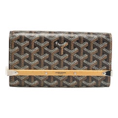Mini estuche Montecarlo de Goyard de lona recubierta de goyardina y piel marrón