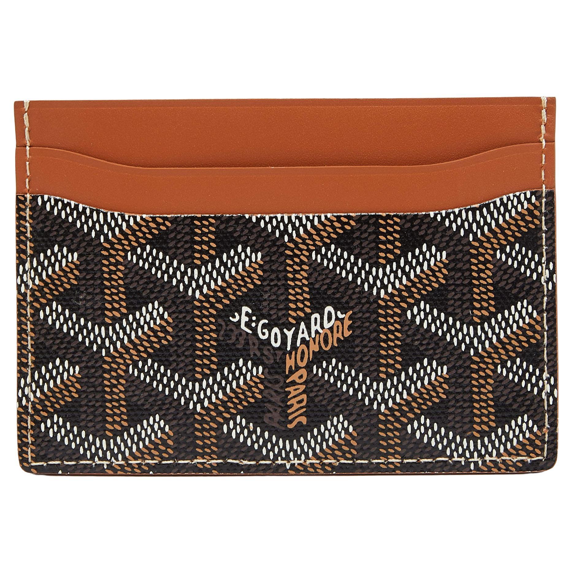 This Saint Sulpice cardholder from Goyard is made from brown Goyardine coated canvas and leather on the exterior with a neatly-lined leather interior. The creation is sleek and can be carried in your pocket or your handbag with ease.

Includes: