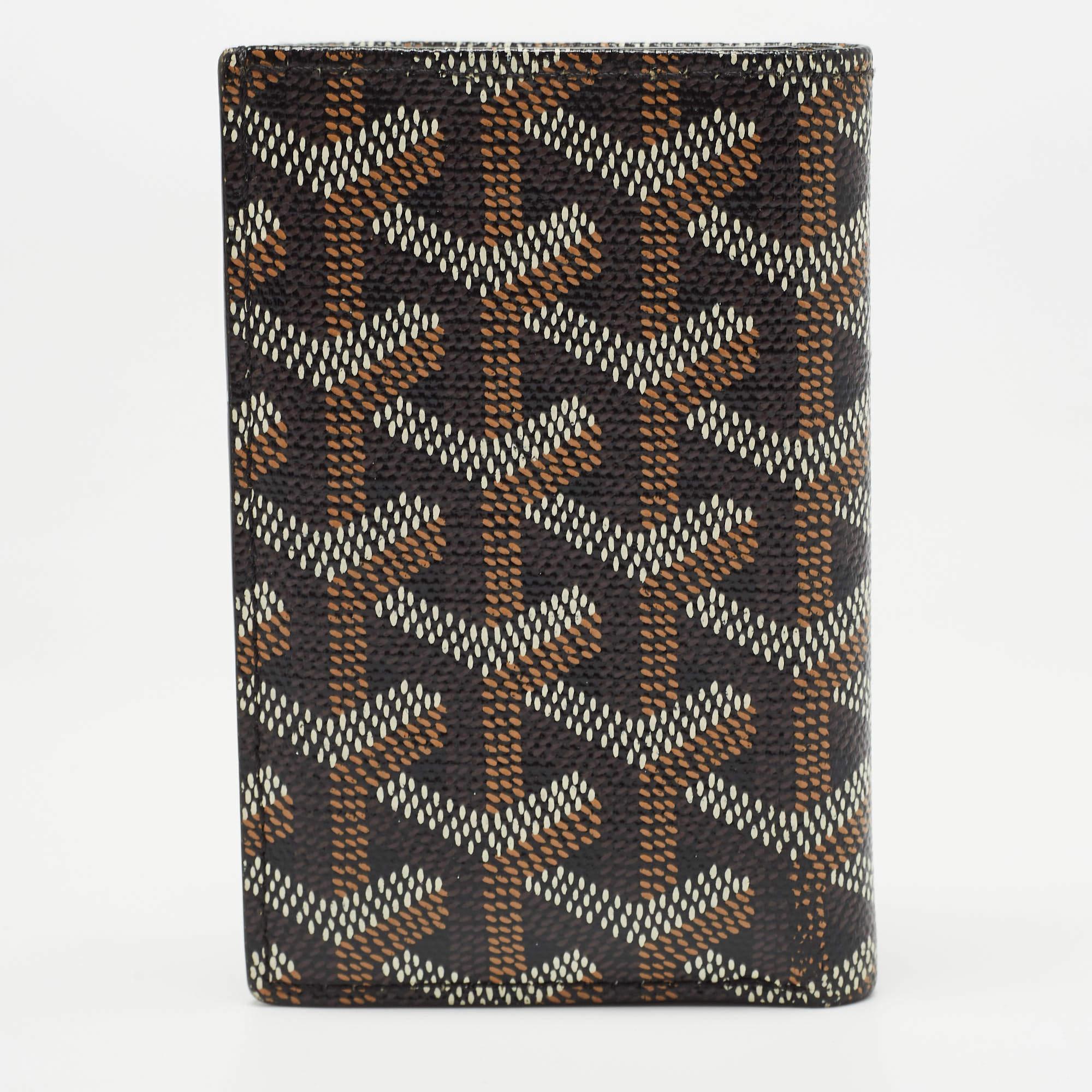 Functional and stylish, this Saint Pierre cardholder from Goyard should be your next buy. Crafted from signature Goyardine coated canvas, this brown cardholder features a bifold silhouette with multiple card slots lined in leather. It can be carried