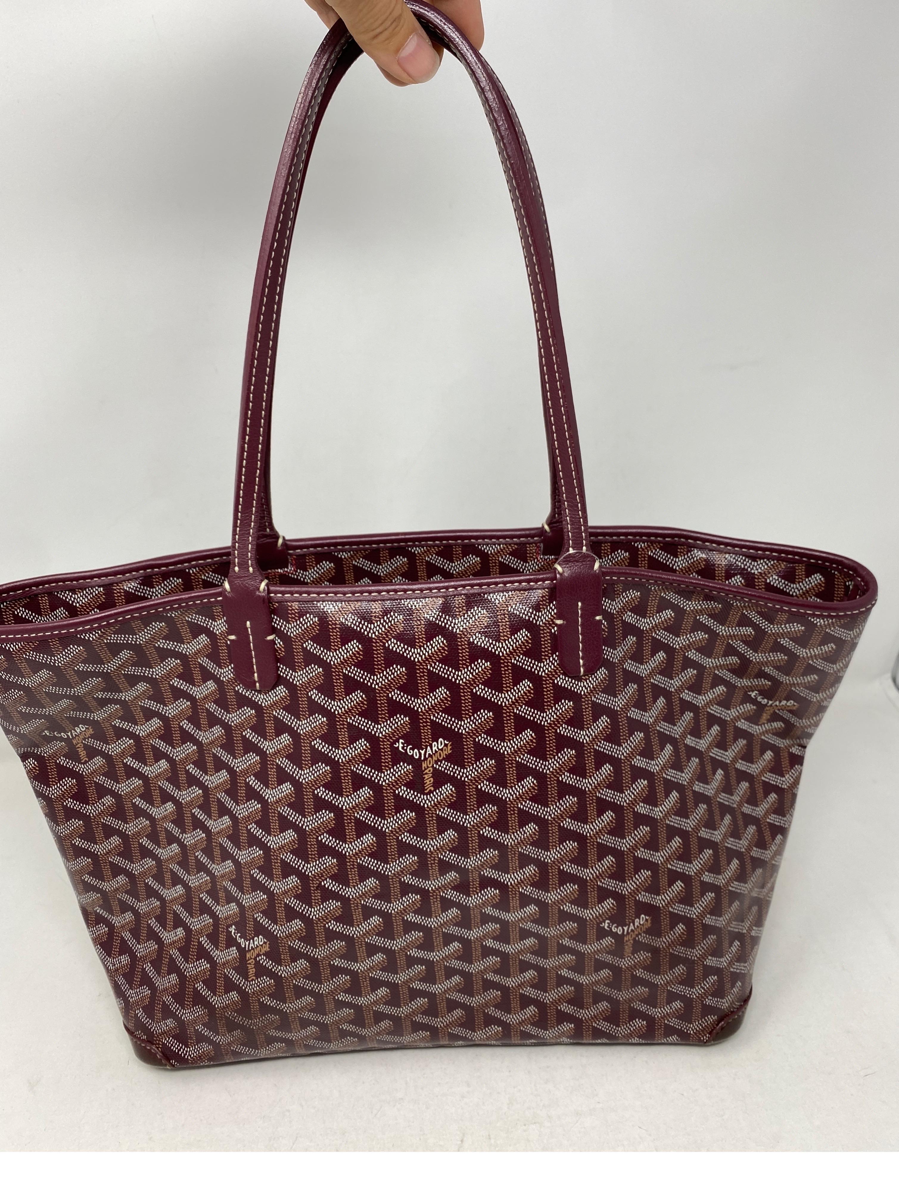 Burgundy top goyard bag