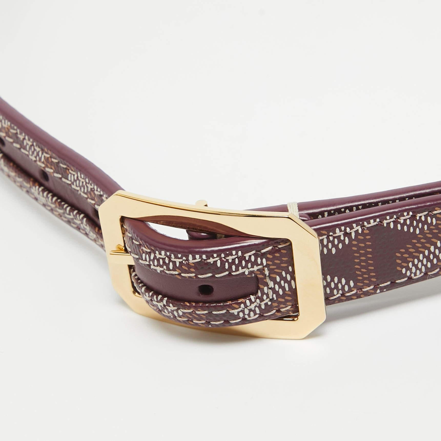The Goyard belt is a luxurious accessory known for its distinctive grey Goyardine pattern on coated canvas, accented with high-quality leather. This iconic belt combines style and craftsmanship, making it a timeless fashion statement.