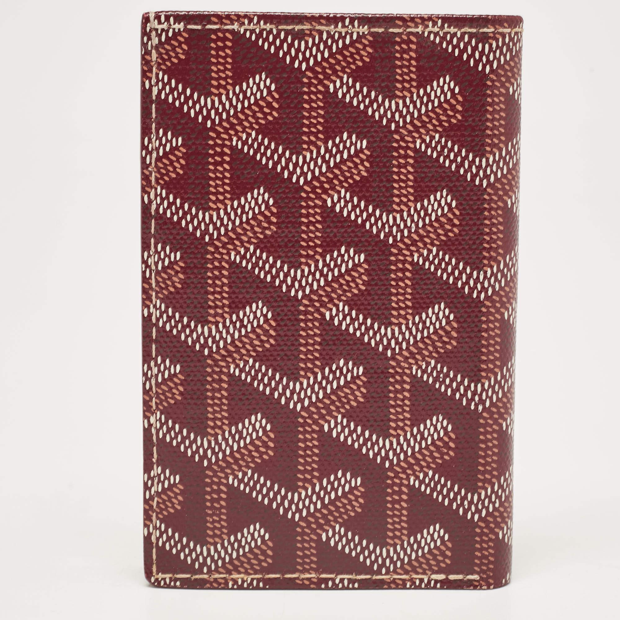Functional and stylish, this Saint Pierre cardholder from Goyard should be your next buy. Crafted from signature Goyardine coated canvas, this burgundy cardholder features a bifold silhouette with multiple card slots lined in leather. It can be