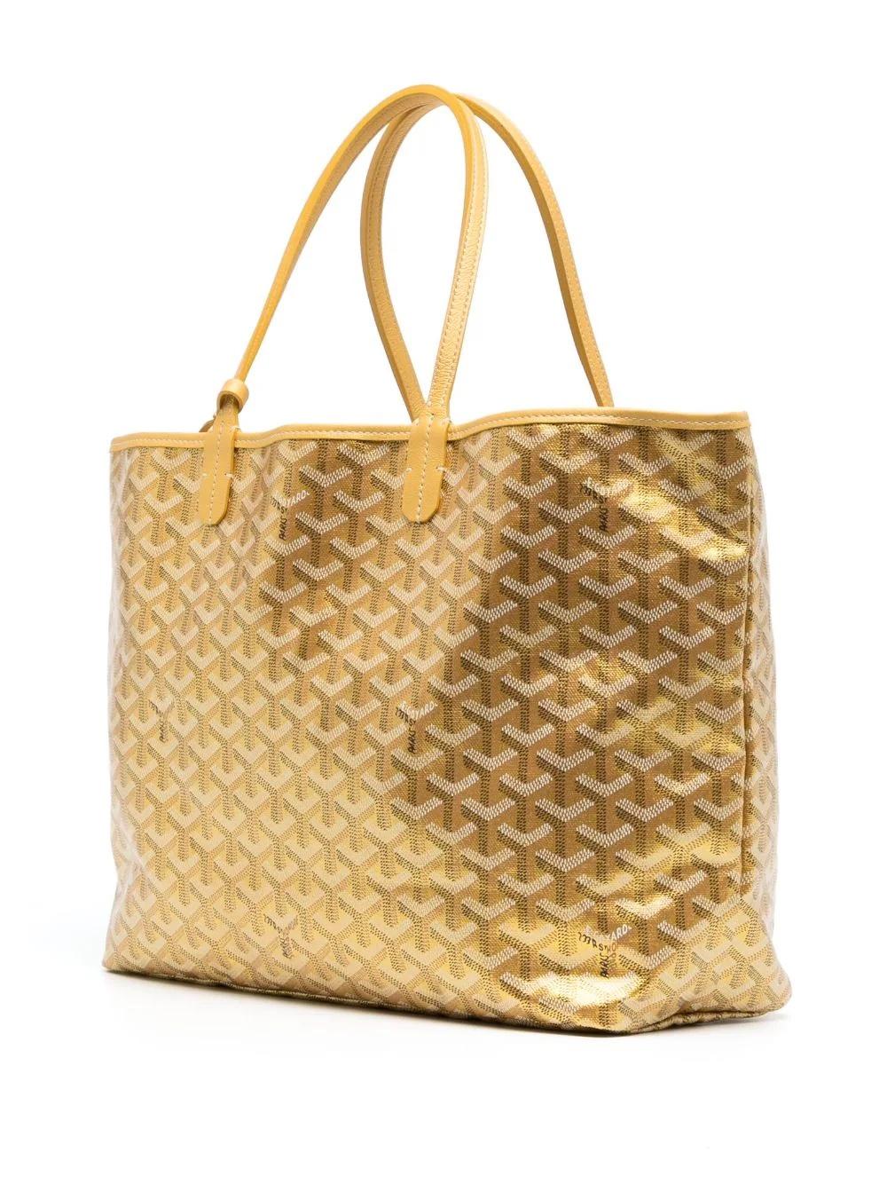 * Gold-tone
* Canvas
* Signature Goyardine pattern
* Butterfly print crafted by our in-house artist
* Two long top handles
* Open top
* Removable pouch
* Rectangle body - PM size
* From the limited edition metallic collection at Goyard
* Excellent