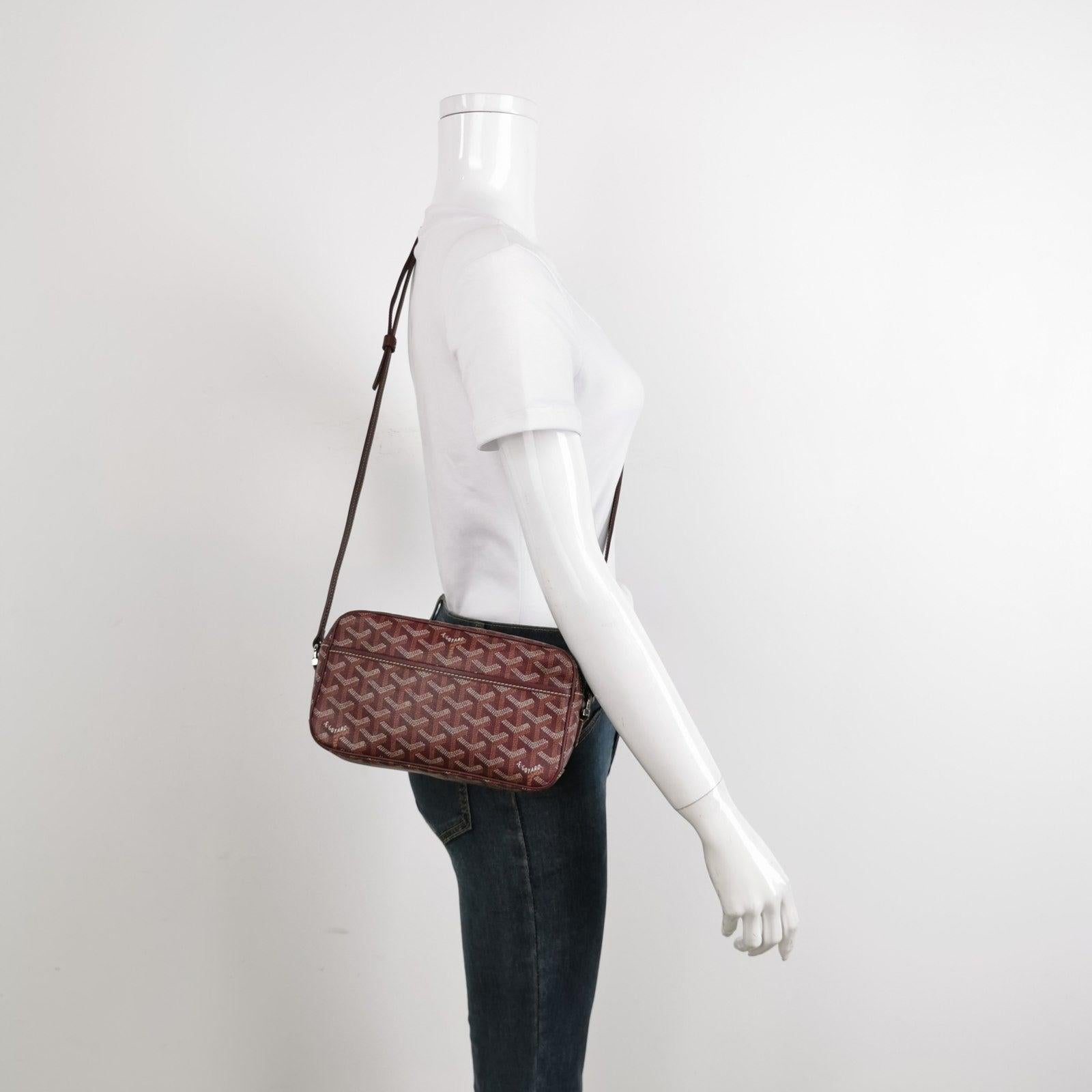 Goyard Cap Vert Crossbody Goyardine Burgundy These are professional photos of the actual bag offered by Luxbags. The Cap-Vert bag serves as an optimal urban companion for keeping essential items neatly organized and easily accessible. Its compact