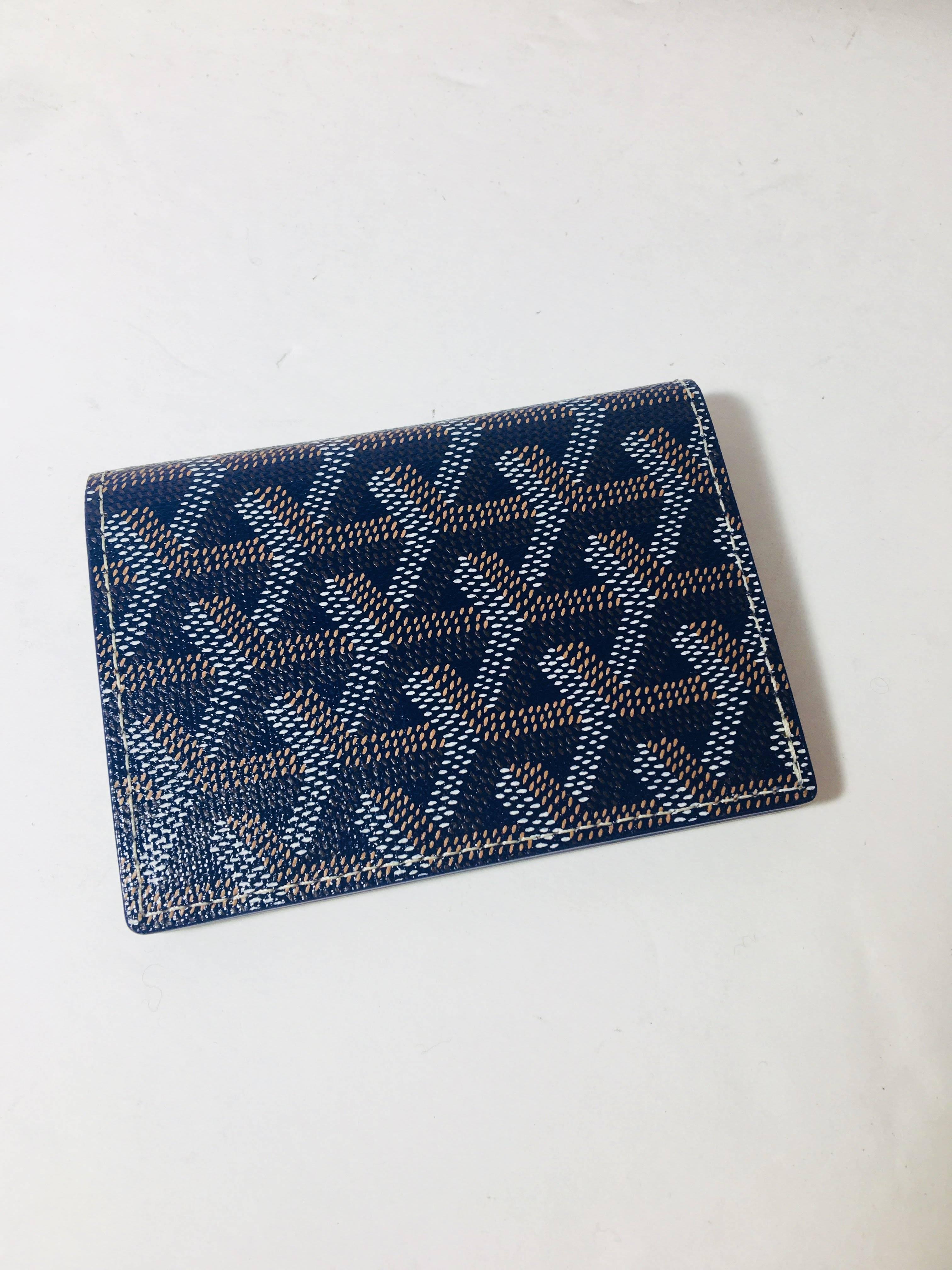 Navy/Brown Leather Bi-Fold Wallet
Retails for $970