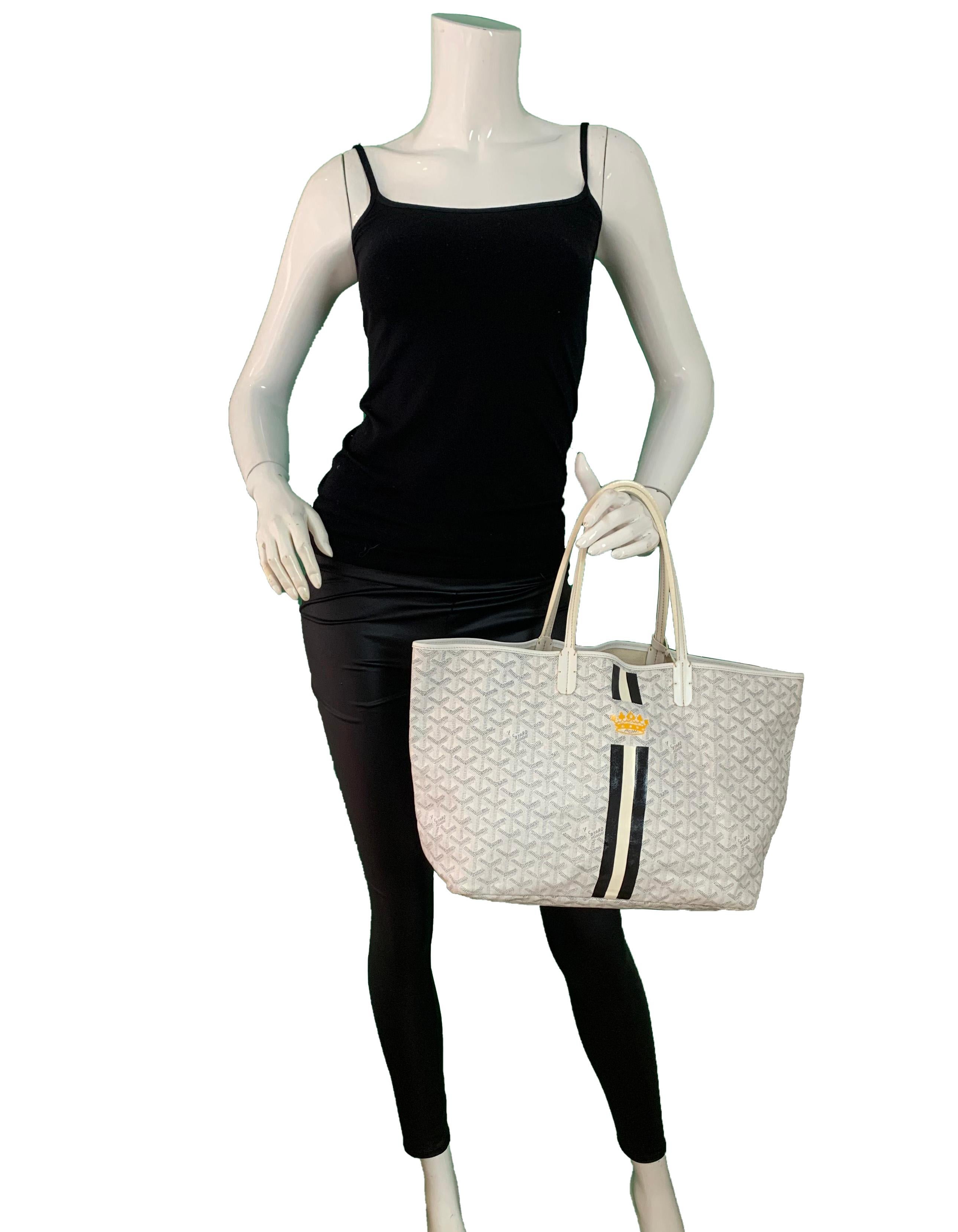 Goyard COLLECTORS White St. Louis PM Tote w. Black/White Painted Stripe & Crown

Made In: France
Color: White with black and yellow
Hardware: Silvertone
Materials: Coated canvas with leather straps
Lining:Textile
Closure/Opening: Open top
Interior