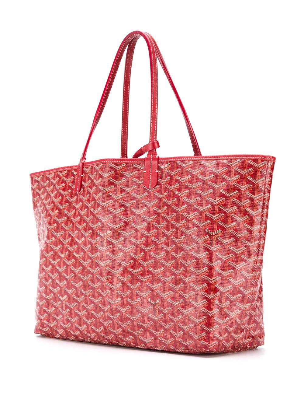 Crafted from Goyardine Canvas, a coloured textile made from cotton, linen and hemp, this red monogram St Louis tote Bag is adorned with a Fornasetti style eye design in a mix of refined luxury and spirited femininity, and especially hand-painted as