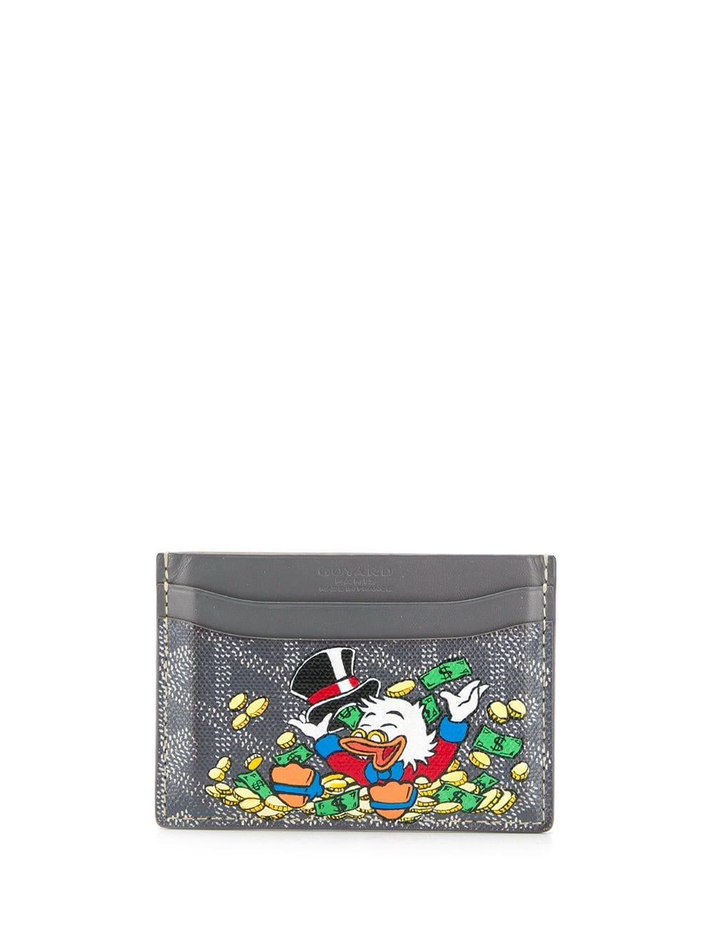 Crafted from Goyardine Canvas, a coloured textile made from cotton, linen and hemp, this grey monogram Slot card Wallet from Goyard is adorned with an all-over cartoon print, especially hand-painted as a part of Rewind Vintage's Emotional Baggage