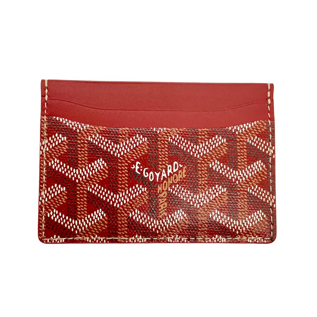 Crafted from Goyardine Canvas, a coloured textile made from cotton, linen and hemp, this red monogram Slot card Wallet from Goyard is adorned with an all-over cartoon print, especially hand-painted as a part of Rewind Vintage's Emotional Baggage