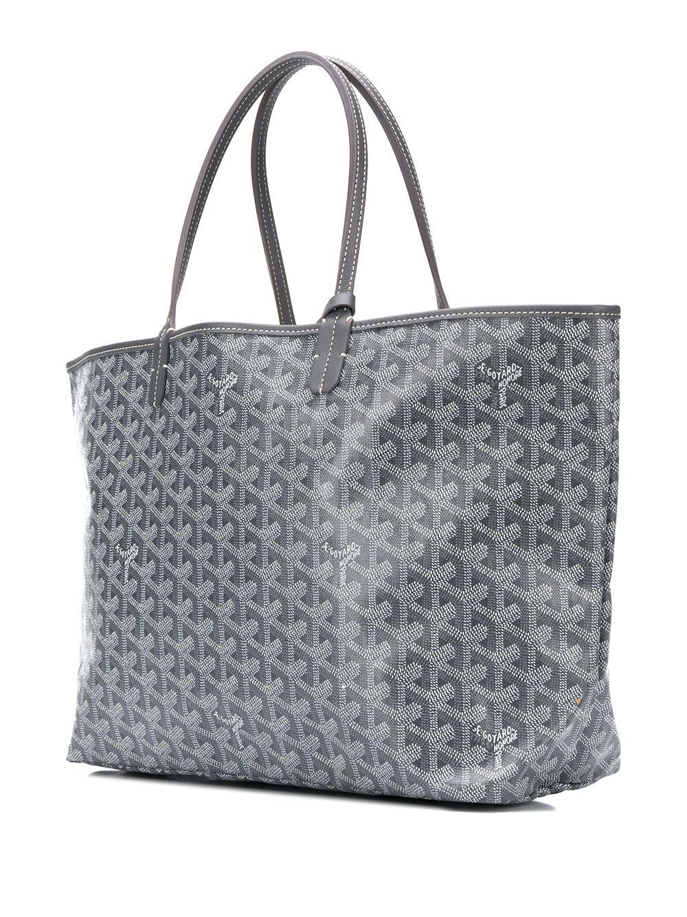Originally designed as a beach bag, the St Louis bag was a reference to King Louis IX of France. Its grey monogram leather displays a kaleidoscope of hand-painted butterflies. The Goyard St Louis handbag is distinctive for its shopper silhouette,