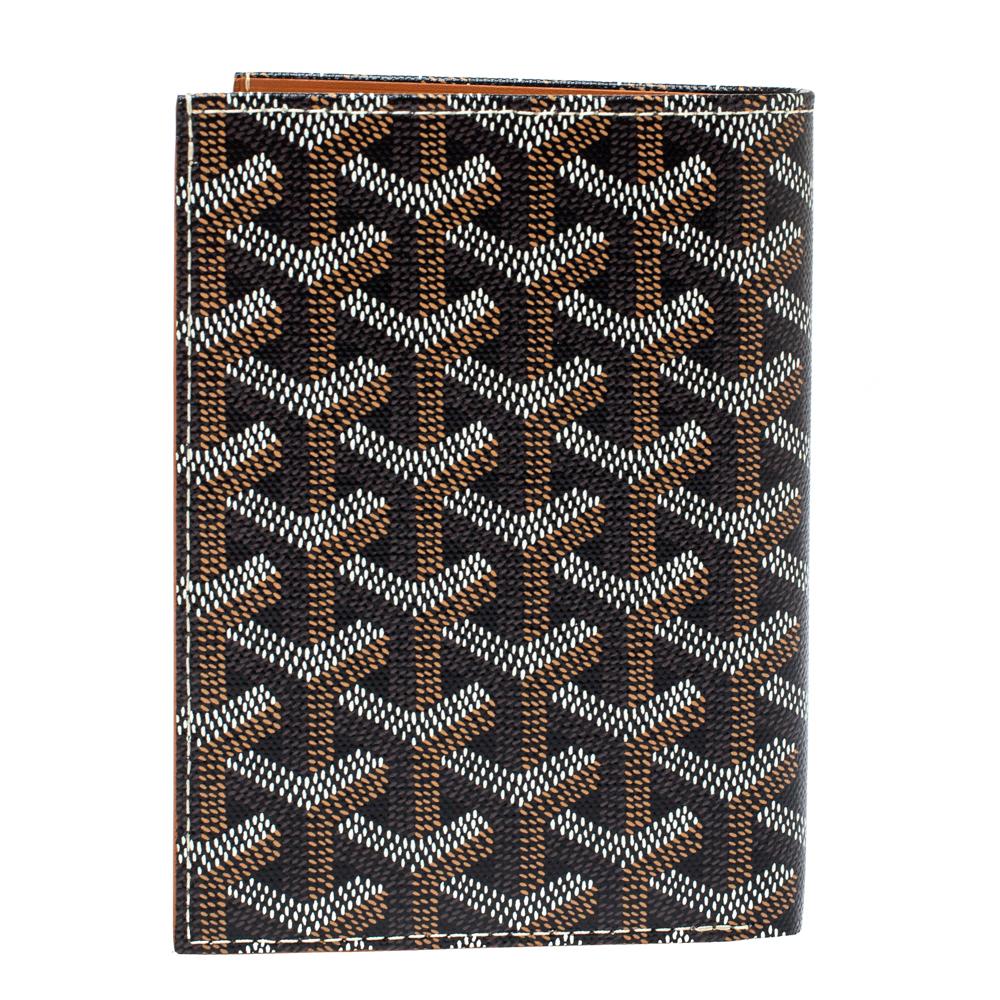Goyard never fails to impress! This Grenelle passport holder comes crafted from dark brown goyardine canvas and opens to a leather interior that houses slip pockets and card slots. Finished with neatly stitched edges, this piece will indeed prove to