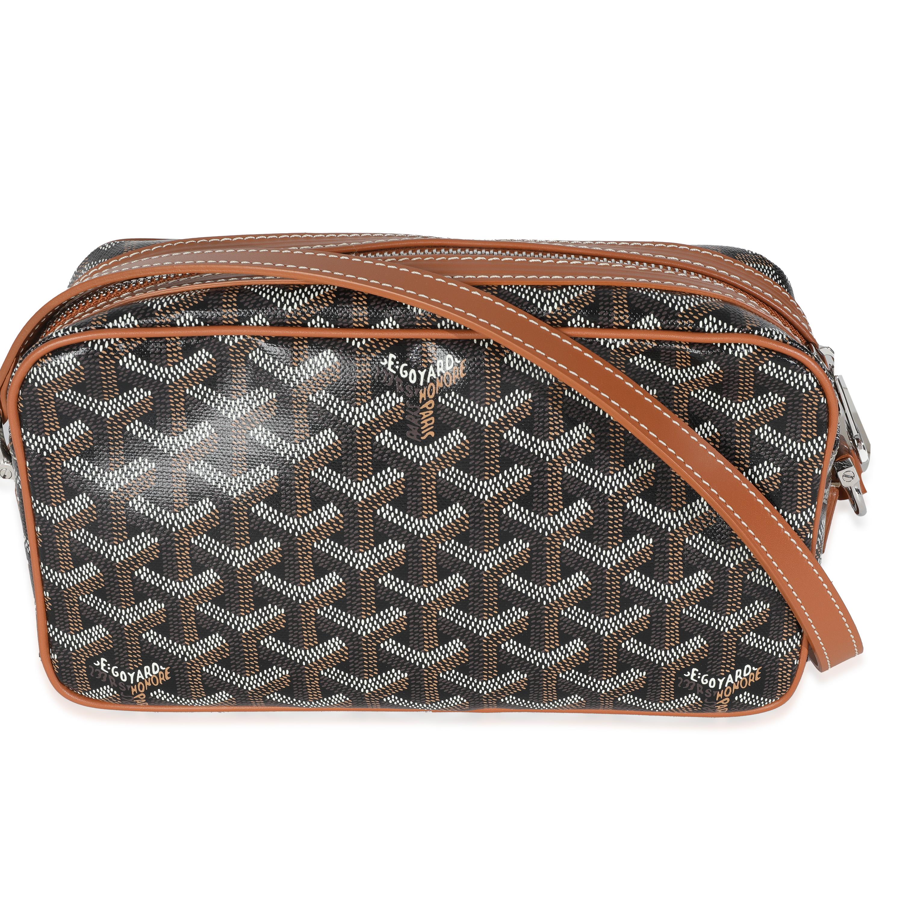 Listing Title: Goyard Gold Black Goyardine Canvas Cap Vert PM
SKU: Z147435
Condition: Pre-owned 
Handbag Condition: Excellent
Condition Comments: Item is in excellent condition and displays light signs of wear. Light cracking along interior