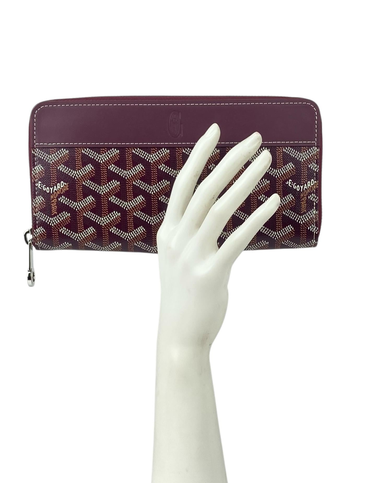 Goyardine Burgundy Goyardine Matignon Zip Around GM Wallet

Color: Burgundy
Materials: Goyardine canvas & vauzelles calfskin
Interior: Burgundy Nièvre Goatskin Lining 
Compartments: 12 card slots, 2 large flat pockets, compartments, secure change