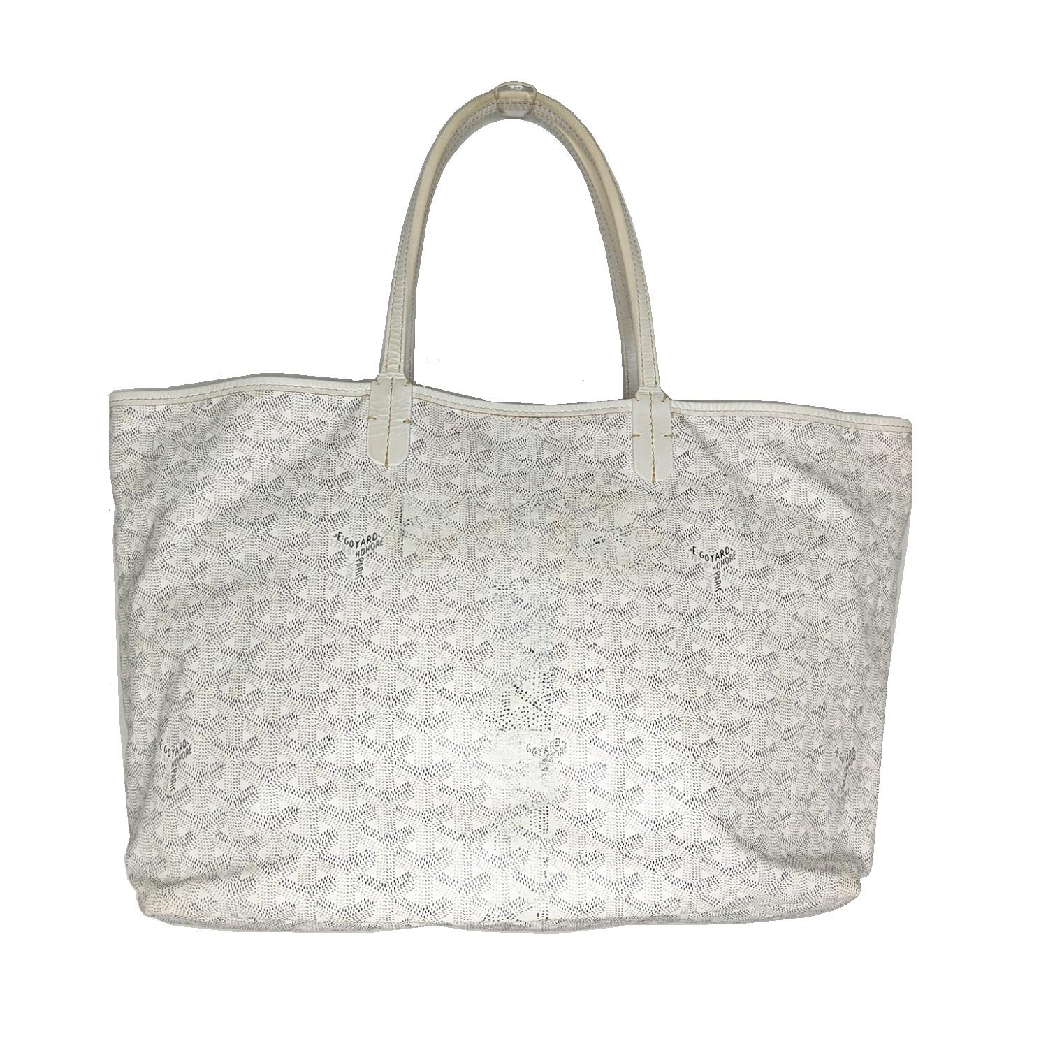 White and grey hand-stenciled Goyardine coated canvas Goyard St. Louis PM with tonal leather trim, dual flat top handles, natural canvas lining and open top.

Designer: Goyard
Material: Goyardine coated canvas with (calf) leather trim
Origin: