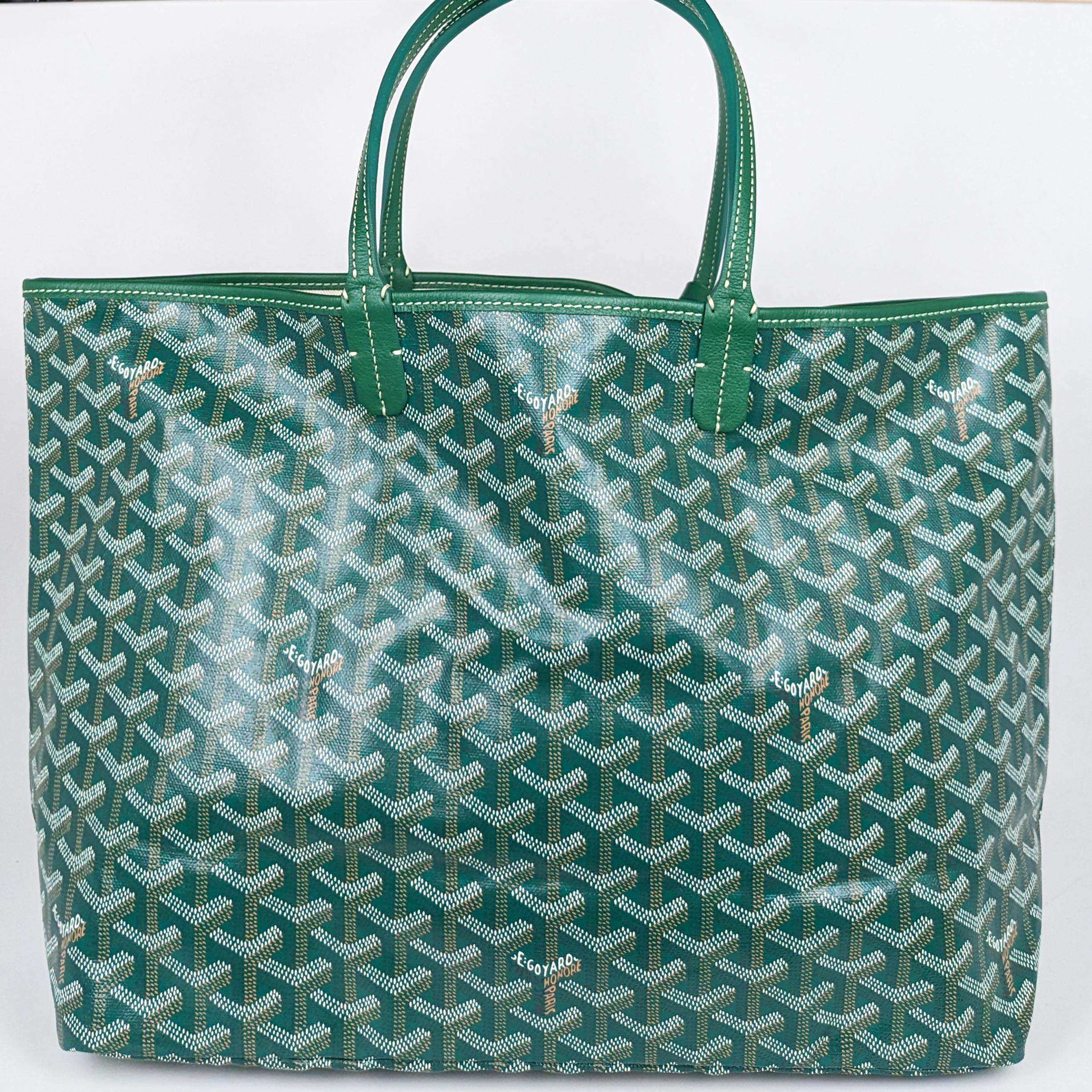 Condition: This authentic Goyard tote is in pristine pre-loved condition. There is a tiny stain in the interior.

No accessories included (dust bag, box, etc.)

Features: Sturdy leather strap handles, matching trim, an open top, and a beige canvas