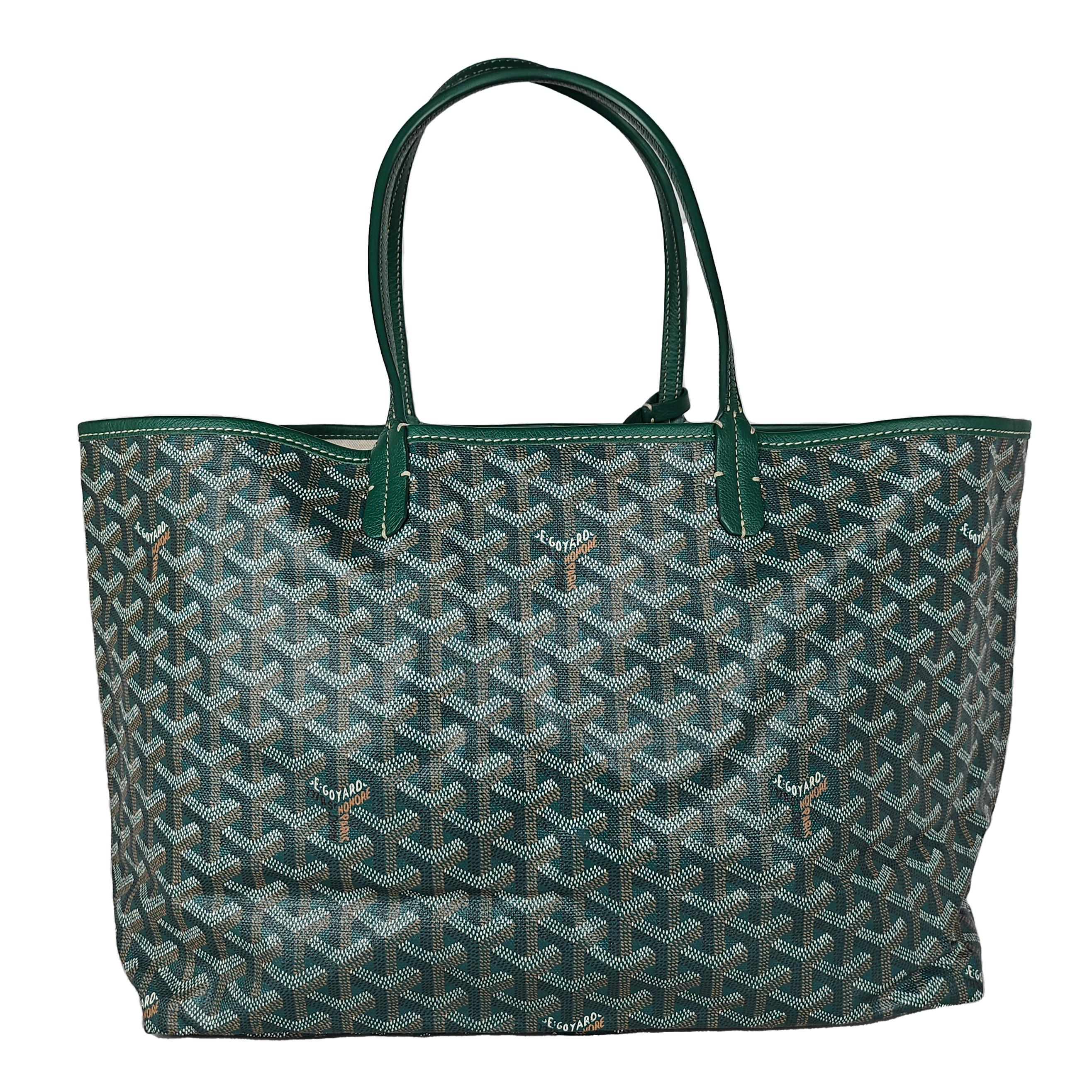 Condition: This authentic Goyard tote is in excellent pre-loved condition. There is faint interior staining and minor corner and trim wear.

No accessories included (dust bag, box, etc.)

Features: Sturdy leather strap handles, matching trim, an