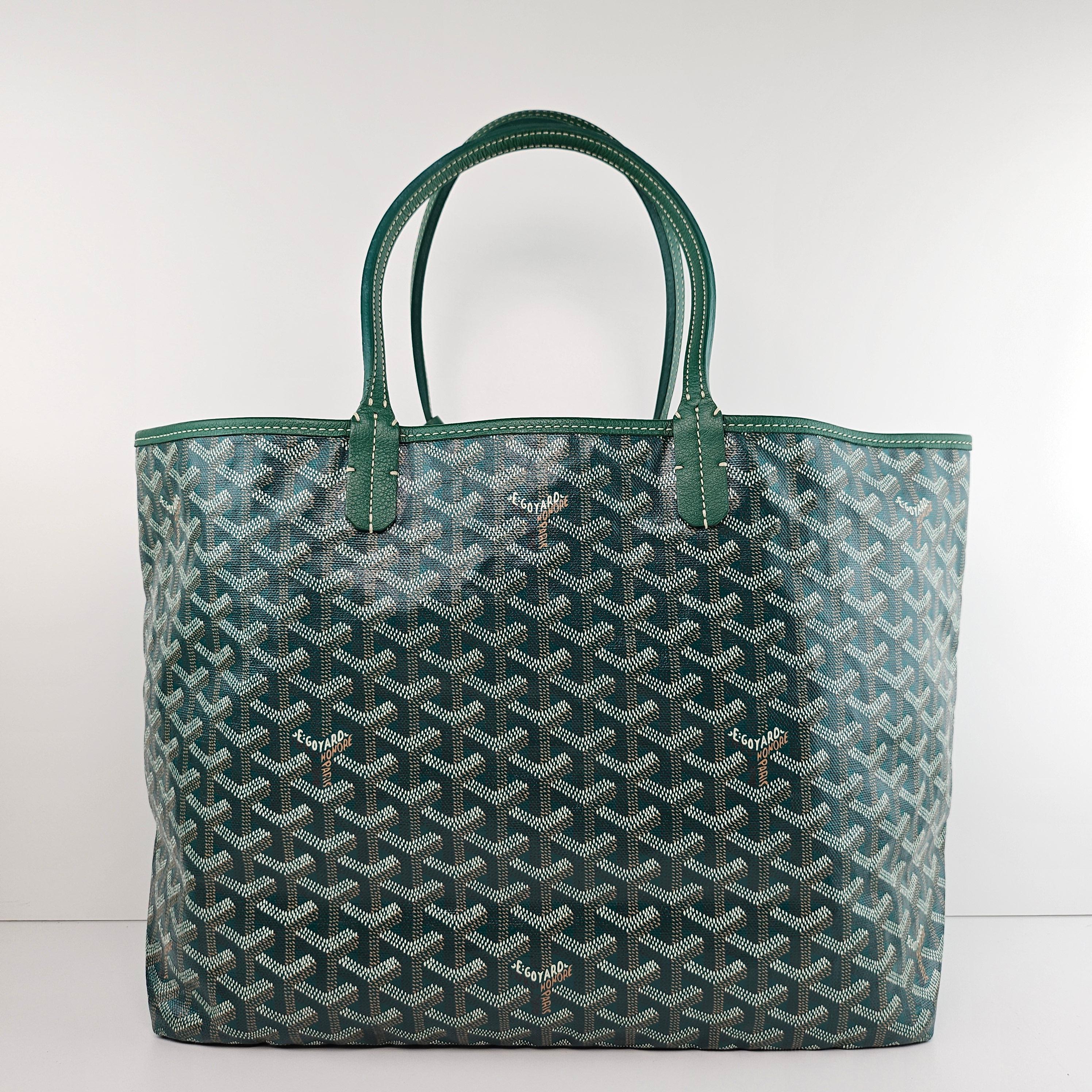 Condition: This authentic Goyard tote is in great pre-loved condition. There are faint interior marks, minor cracking on base straps, and light corner wear.

No accessories included (dust bag, box, etc.)

Features: Sturdy leather strap handles,