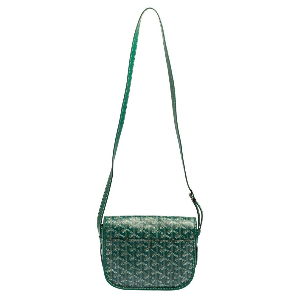 Carry this stylish Goyard Belvedere saddle bag to the Sunday brunch and look uber cool! Crafted in Goyardine canvas & leather, the bag features the iconic chevron print with an adjustable leather strap and silver-tone hardware. Lined in canvas, the