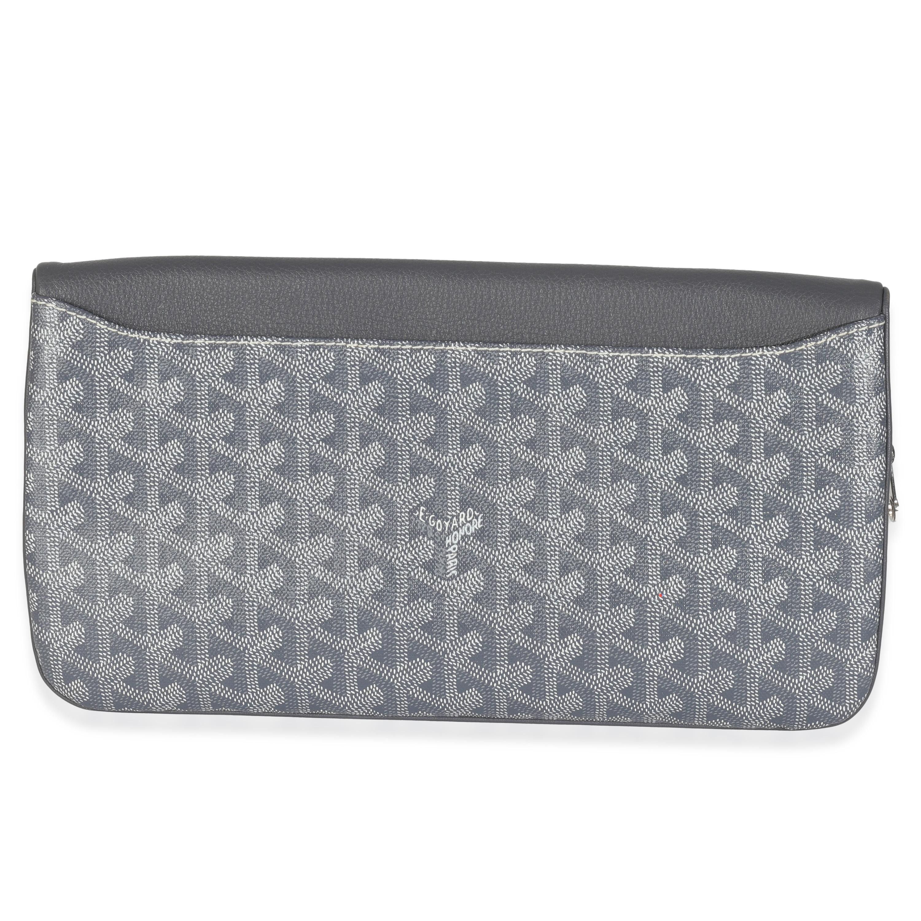 Listing Title: Goyard Grey Goyardine Canvas Sainte Marie Soft Clutch
SKU: 146626
Condition: Pre-owned 
Condition Description: Goyard’s signature Goyardine pattern has quietly taken over the luxury fashion scene. A heritage brand that has been around