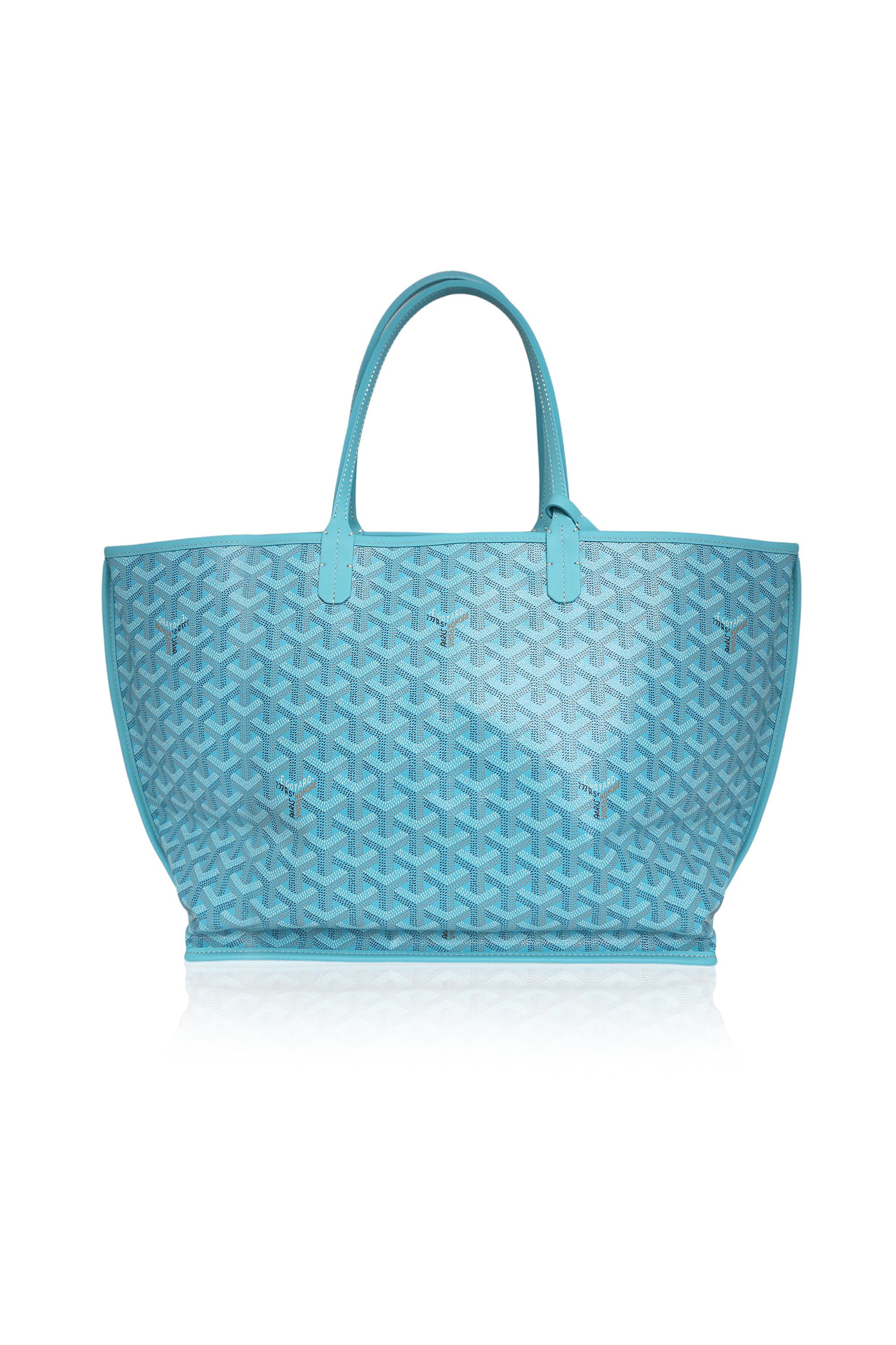 This limited-edition turquoise Goyard Anjou Seahorse Bag is Saint Louis reinterpreted. Reversible and versatile, with Goyardine canvas on one side and leather on the other. The intricate embroidery design showcases two seahorses, a symbol of