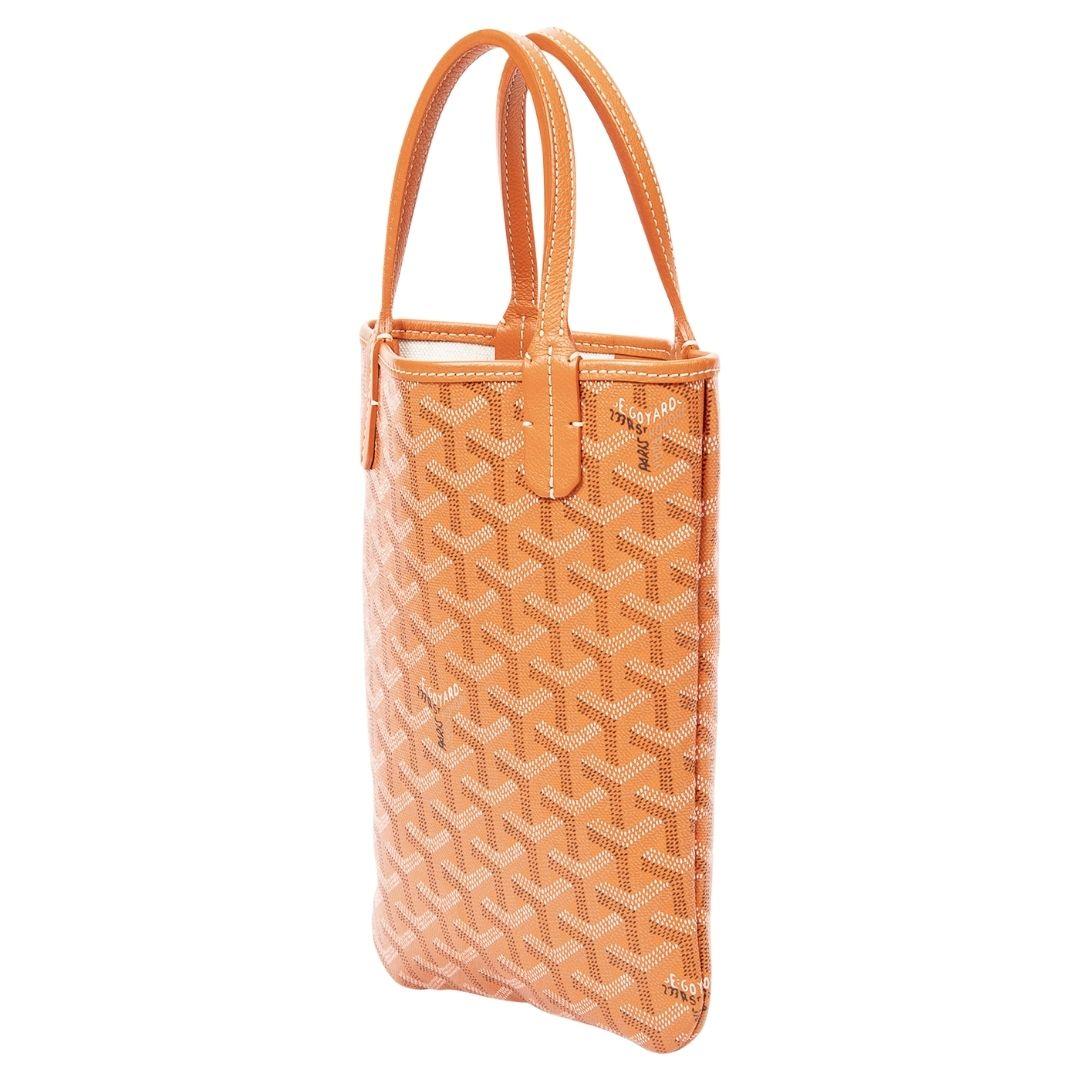 The Goyard Poitier Tote in vivid orange coated canvas features simple silver hardware and an open top. This bag’s spacious interior is lined with canvas, ideal for a minimalist yet fashionable statement.

SPECIFICS
• Length: 6.3