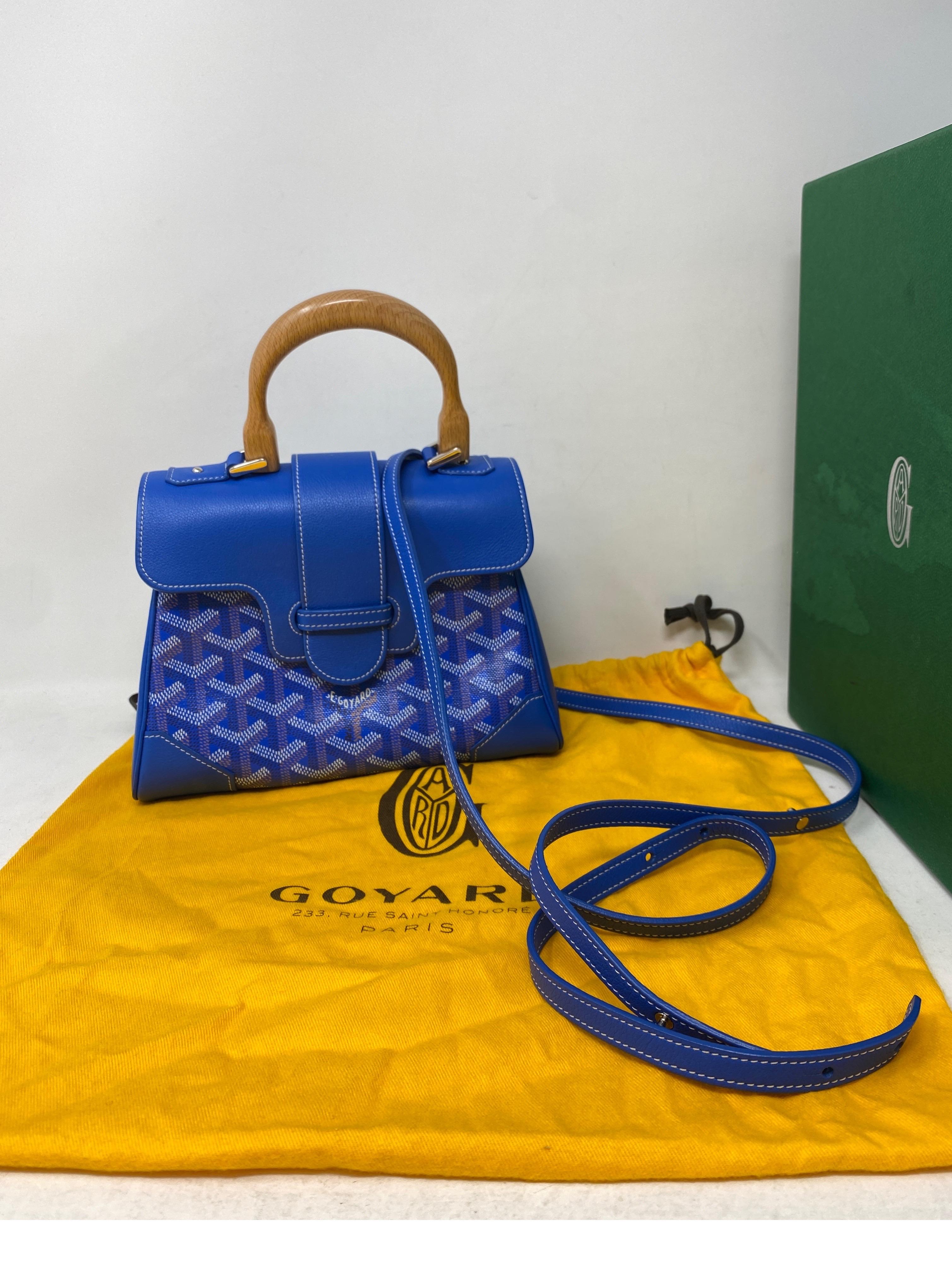 Goyard Mini Blue Saigon Bag. Mint like new condition. Can be worn as a crossbody bag or top handle bag. Rare size and color. Includes dust cover and box. Guaranteed authentic. 