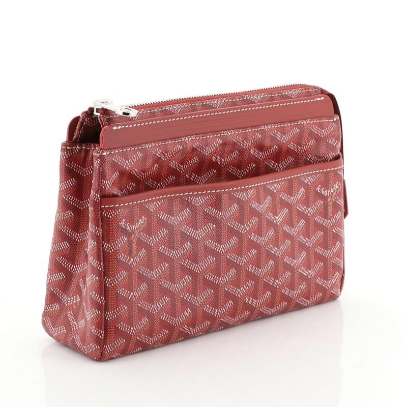 This Goyard Miroir Toiletry Bag Coated Canvas PM, crafted from red coated canvas, features exterior slip pocket, leather trim and silver-tone hardware. Its zip closure opens to a yellow fabric interior with slip pocket. These are professional