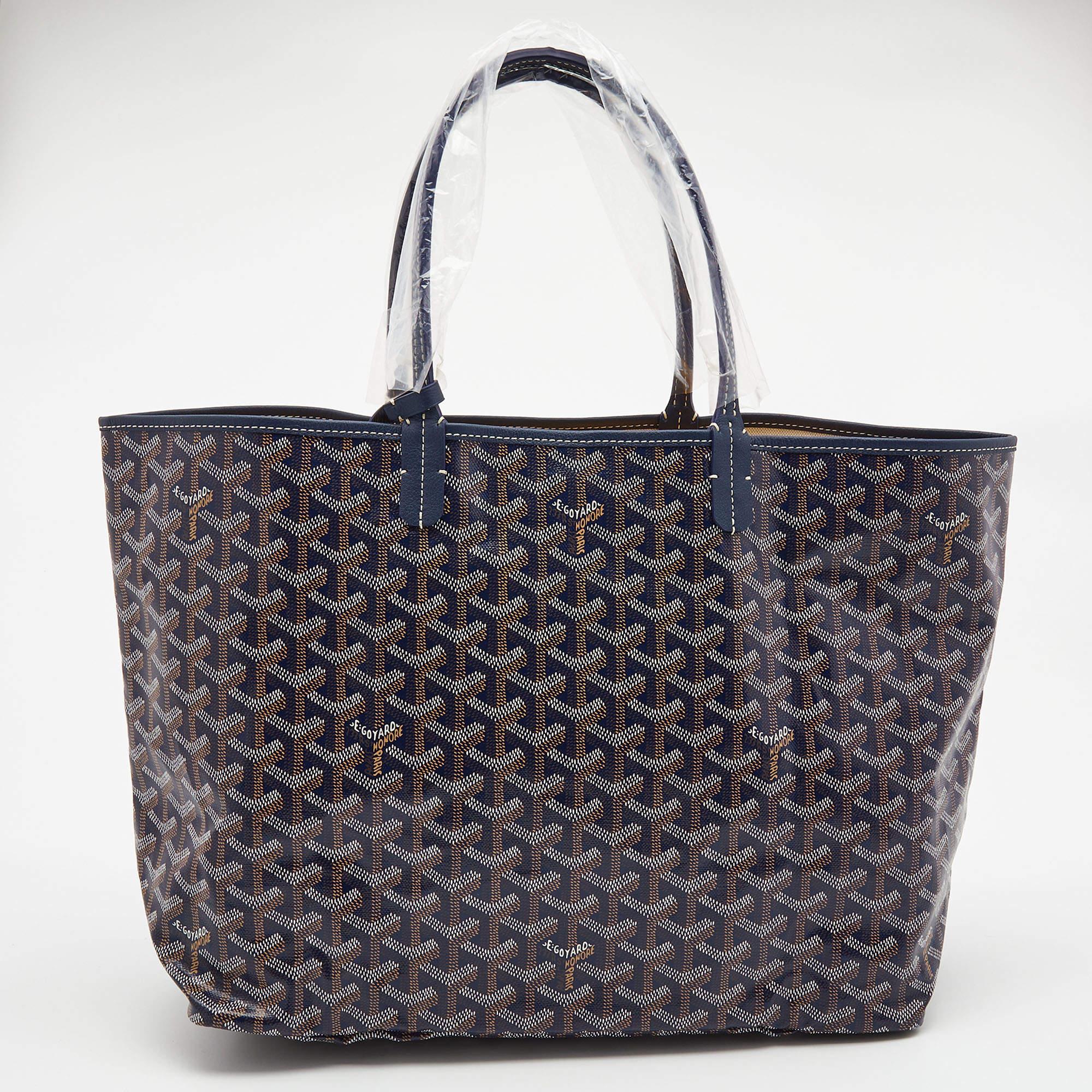 A charming creation by Goyard, this Saint Louis tote is the result of impeccable construction and artistic design. It is created from the signature Goyardine-coated canvas and leather into a versatile silhouette. With a perfect combination of