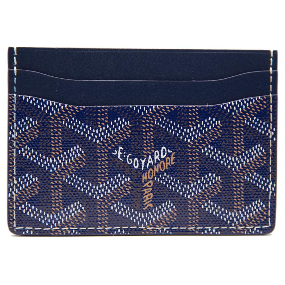Crafted from Goyardine Canvas, a coloured textile made from cotton, linen and hemp, this navy blue monogram Slot card Wallet from Goyard is adorned with an all-over cartoon print, especially hand-painted as a part of Rewind Vintage's Emotional
