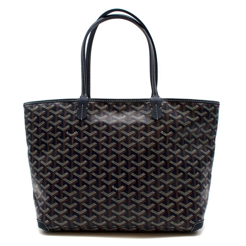 Goyard Navy Goyardine Artois PM Tote Bag

The Artois bag  has a zip fastening system and overstitched leather corners for good resistance to abrasion. It reinterprets the Saint Louis tote with a number of clever details all of its own: longer