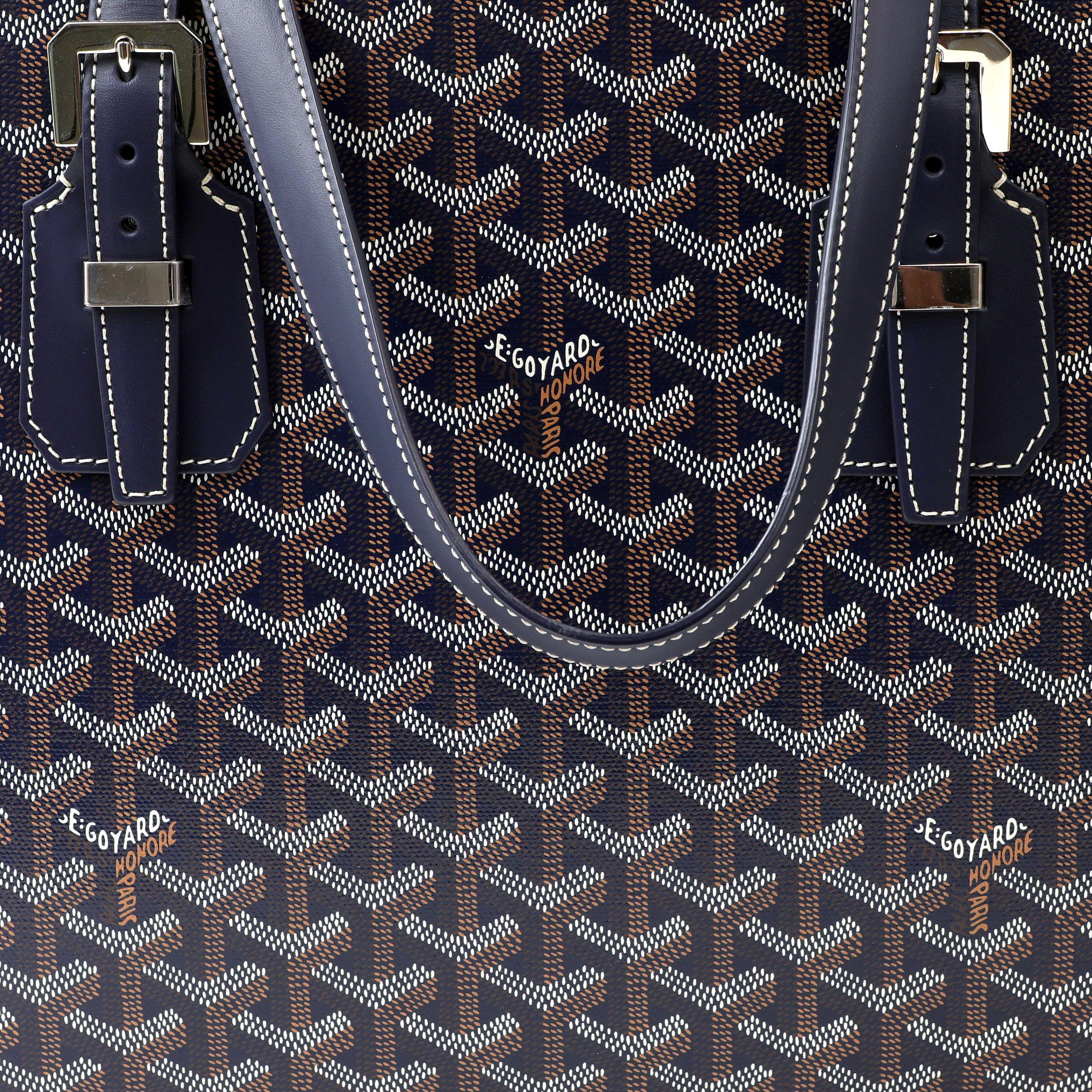 This authentic Goyard Navy Okinawa PM Tote is pristine; likely never carried.  Navy blue coated canvas iconic Goyard monogram with dark navy leather straps and trimmings.  Silver zippered top.  Dust bag included. 

PBF 13918
