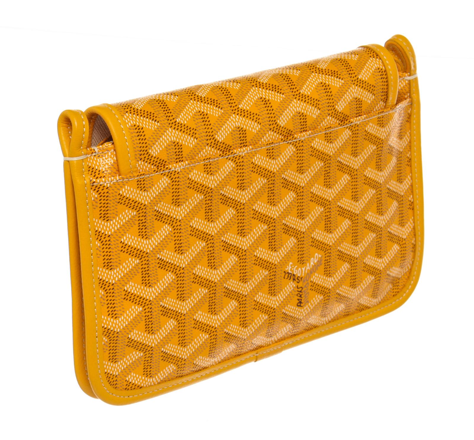 Goyard Orange Leather Plumet Wallet with leather, gold-tone hardware, trim leather, interior zip pockets, and snap closure.

220053MSC