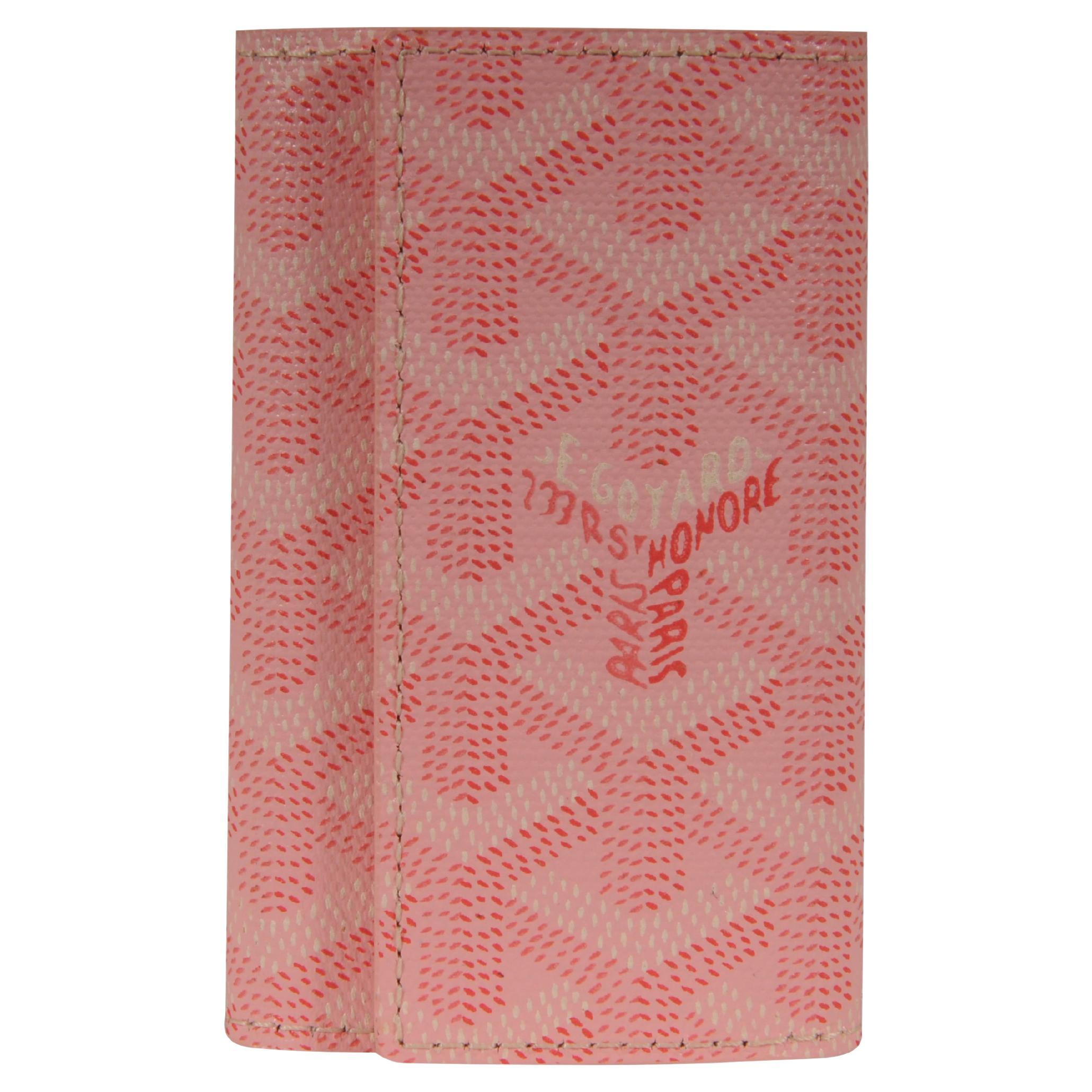 Cartera de viaje con seis llaveros Goyard Saint Michel rosa en venta